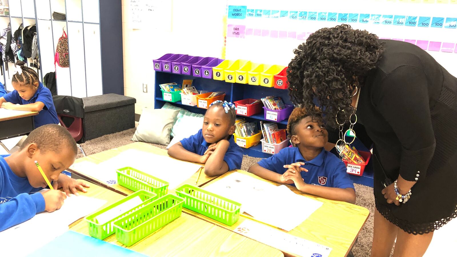 Principal Michelle Lyons greets one of Cornerstone Prep Denver’s students.