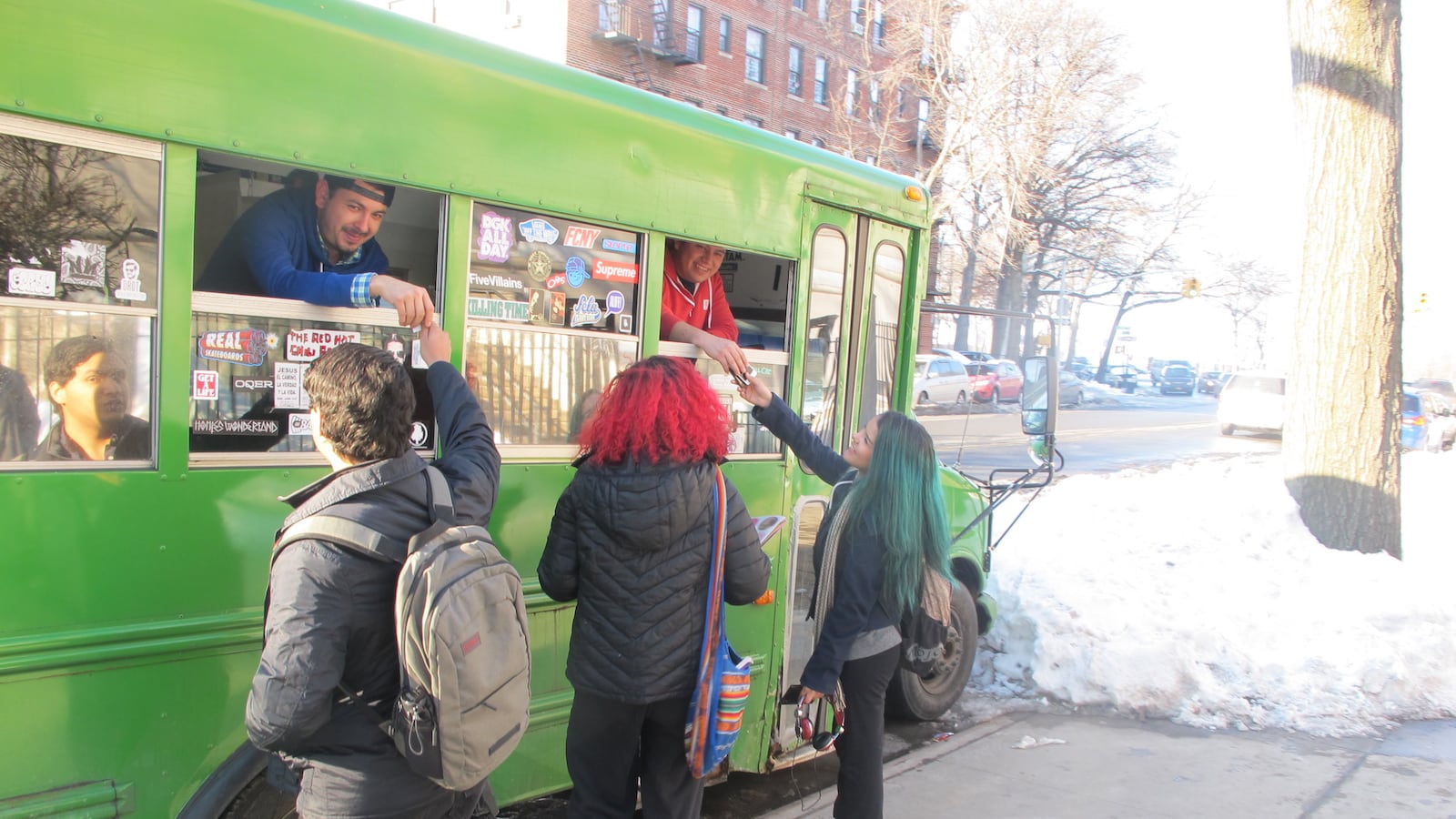 Students outside the Walton Educational Complex retrieve their phones from a vendor after school.