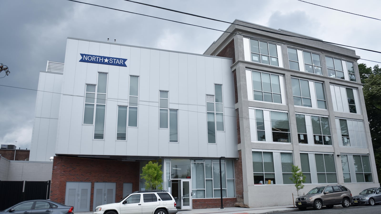 A school building has a blue sign on the top left corner that reads North Star in white lettering with a white star shape between the two words.