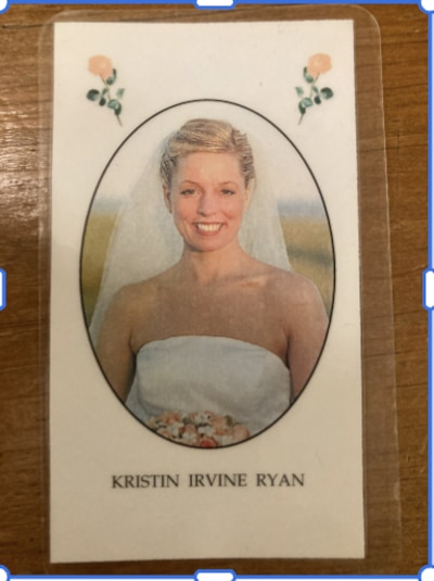 A photo of a woman in a wedding dress.