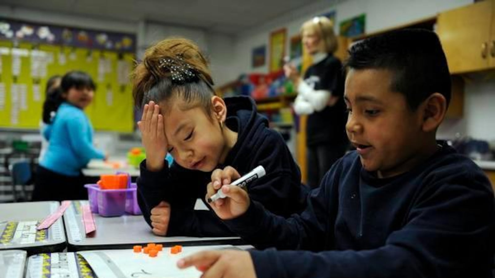 Aris Mocada-Orjas, left, and Abel Albarran work on a math problem at Hanson Elementary in Commerce City. (Denver Post file photo)