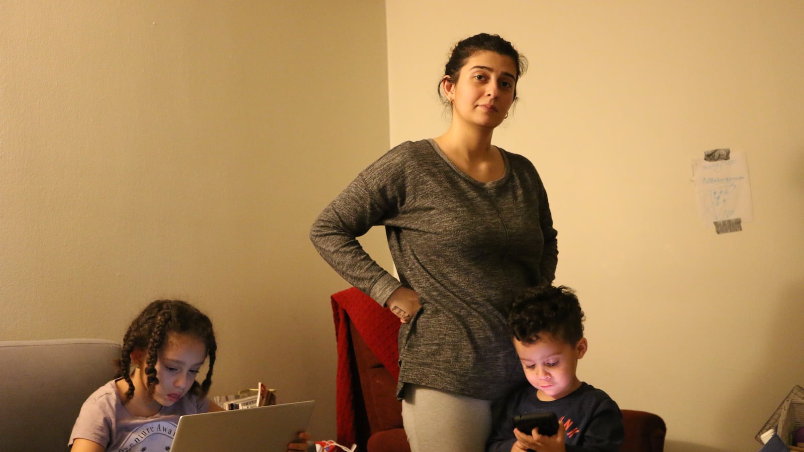 Lisa Vasquez, center, with her two children.