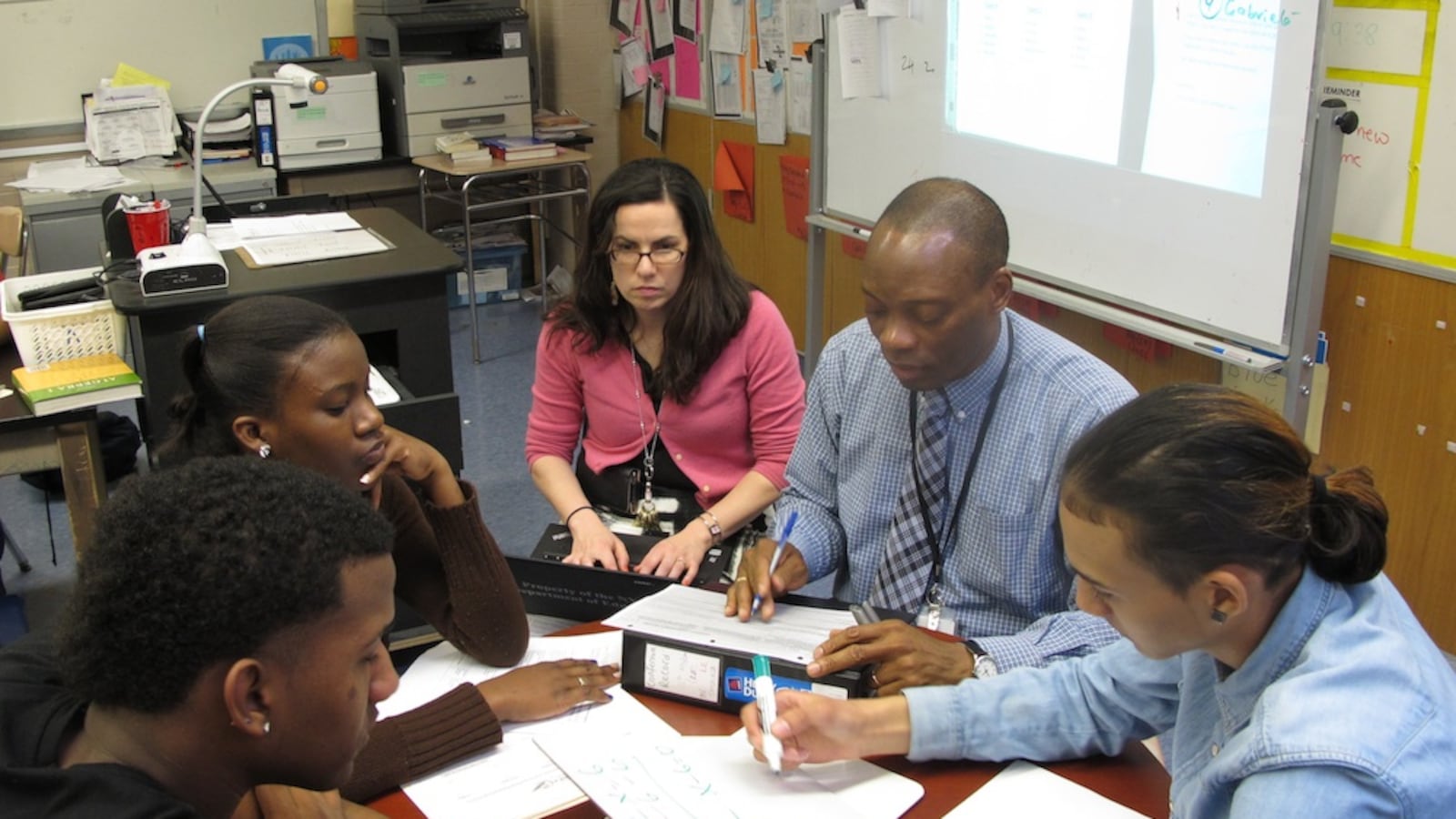 A New York City principal takes notes on her computer during classroom observation for new teacher evaluations.