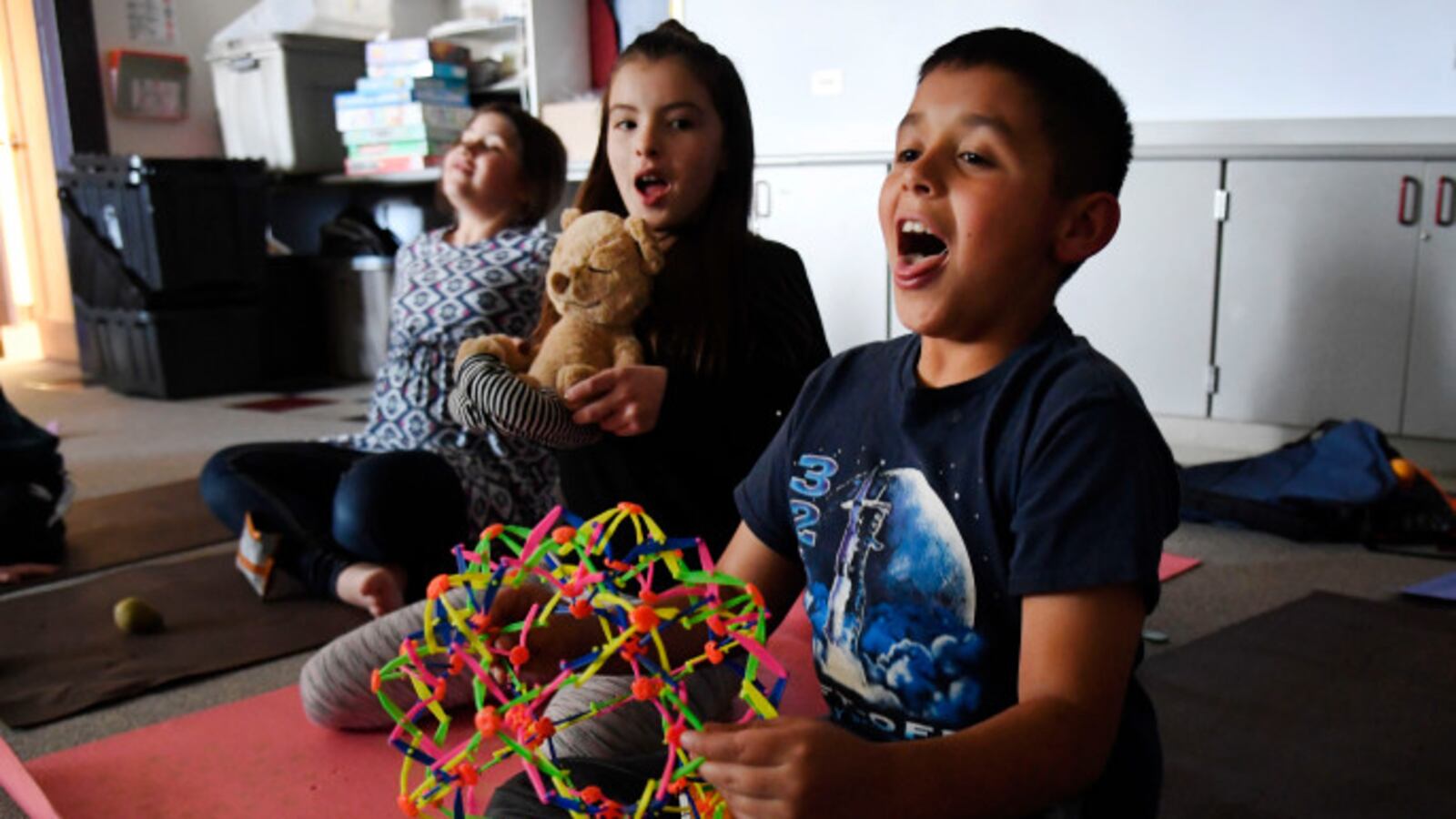 Students work on breathing exercises during a yoga class at the end of the school day at Pennington Elementary School.