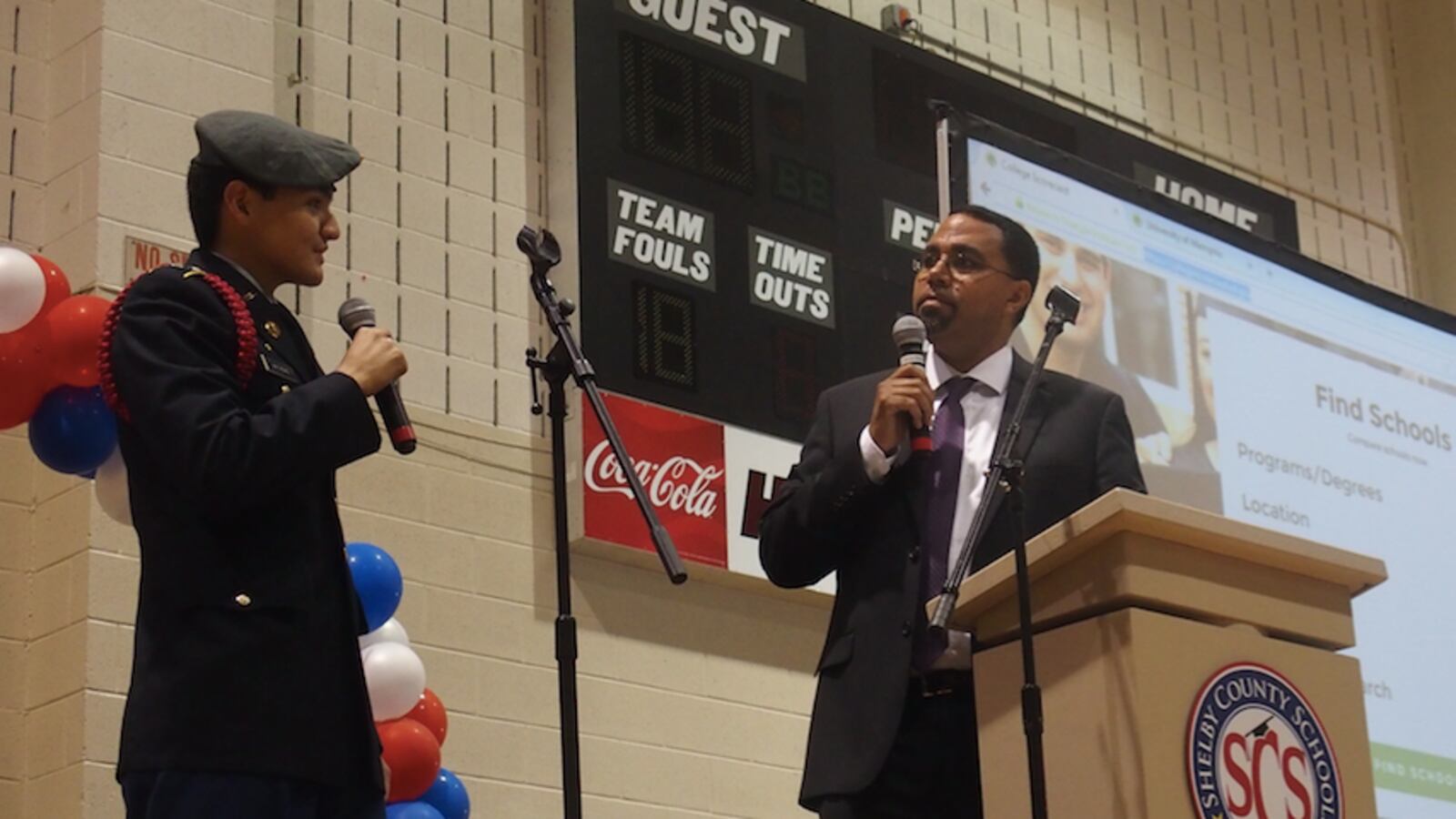 U.S. Education Secretary John B. King Jr. and Craigmont High School senior Kevin Mathews demonstrate how to use the U.S. Department of Education's College Scorecard, which helps students and parents sift through information about colleges. King visited Memphis Wednesday as part of the department's back-to-school bus tour.