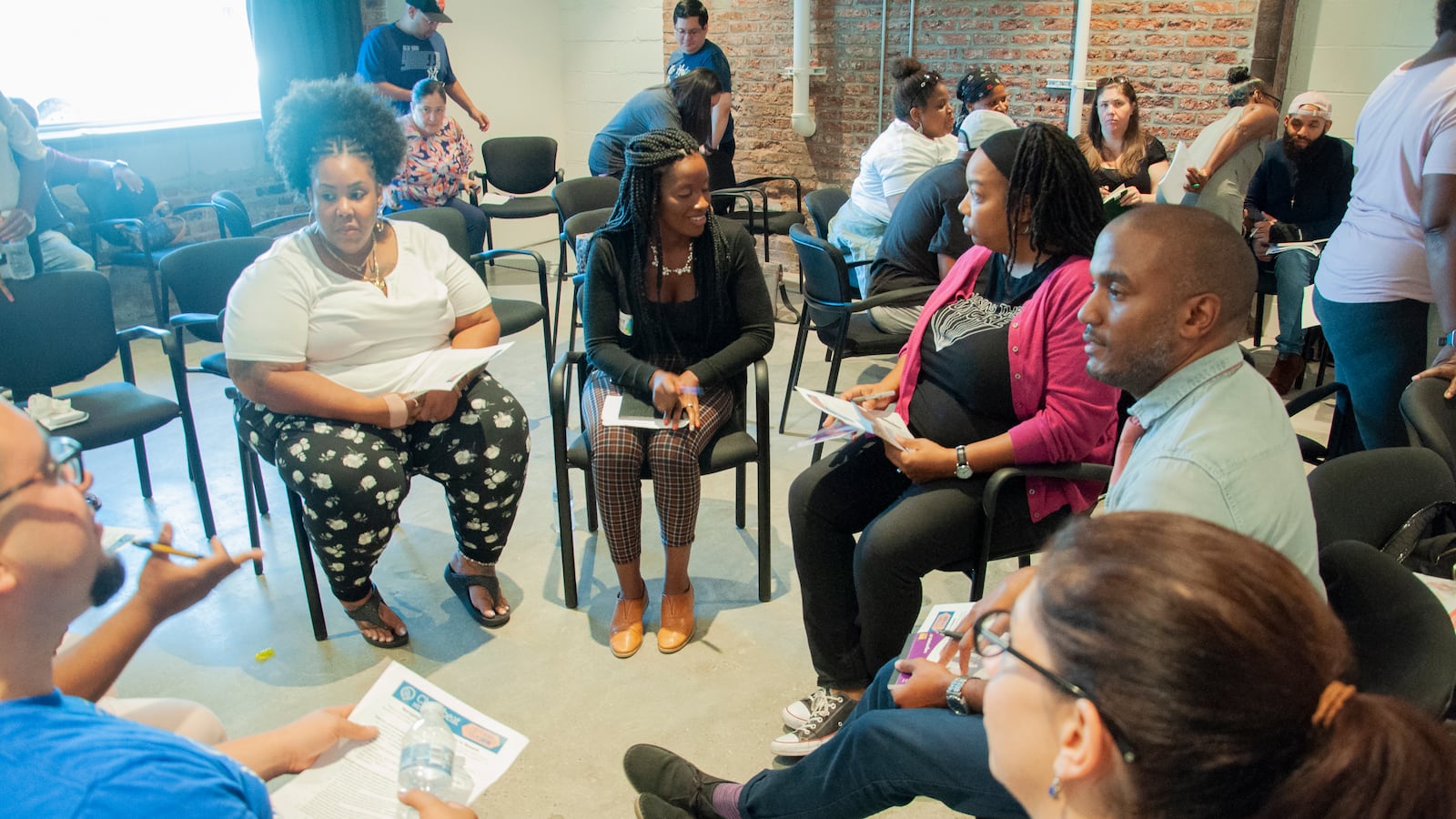 Listening tour attendees split up into a group to have an in-depth discussion on special education in Newark.