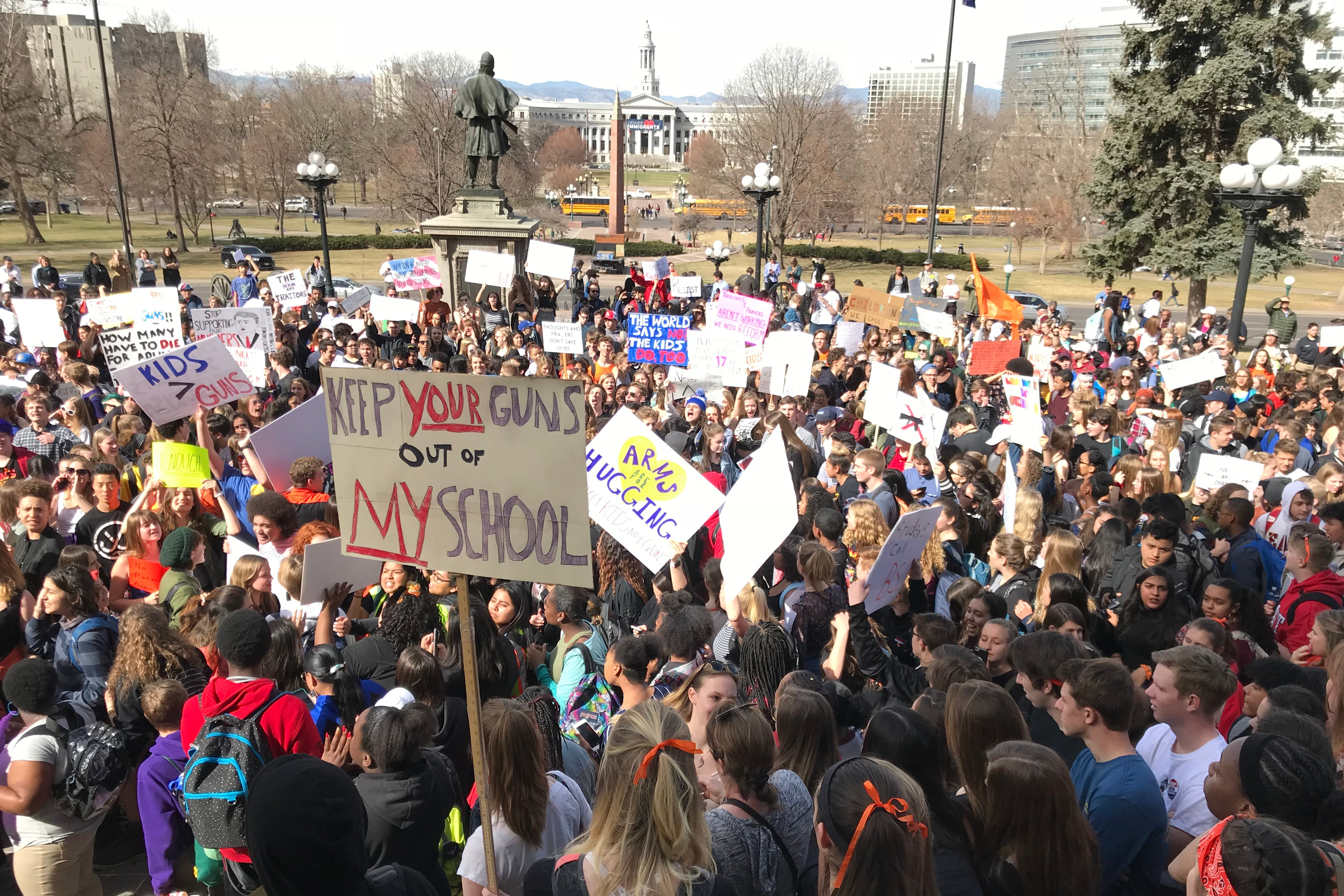 A photograph of a group of protestors outside on a cold day.