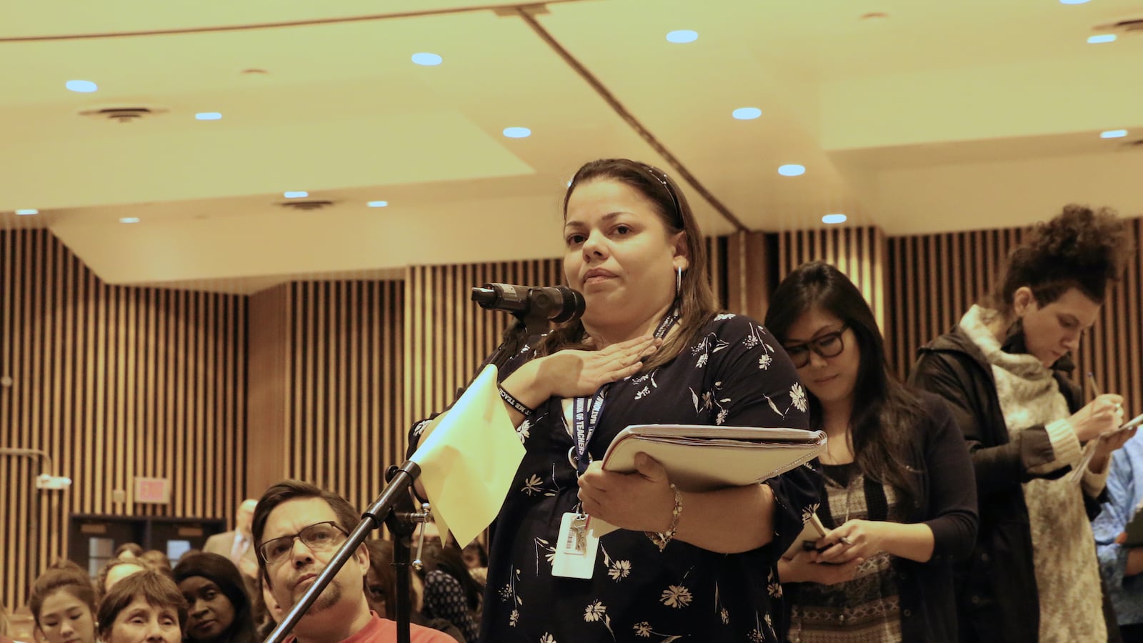 Teacher Aixa Rodriguez speaks at a Panel for Educational Policy meeting in 2016.