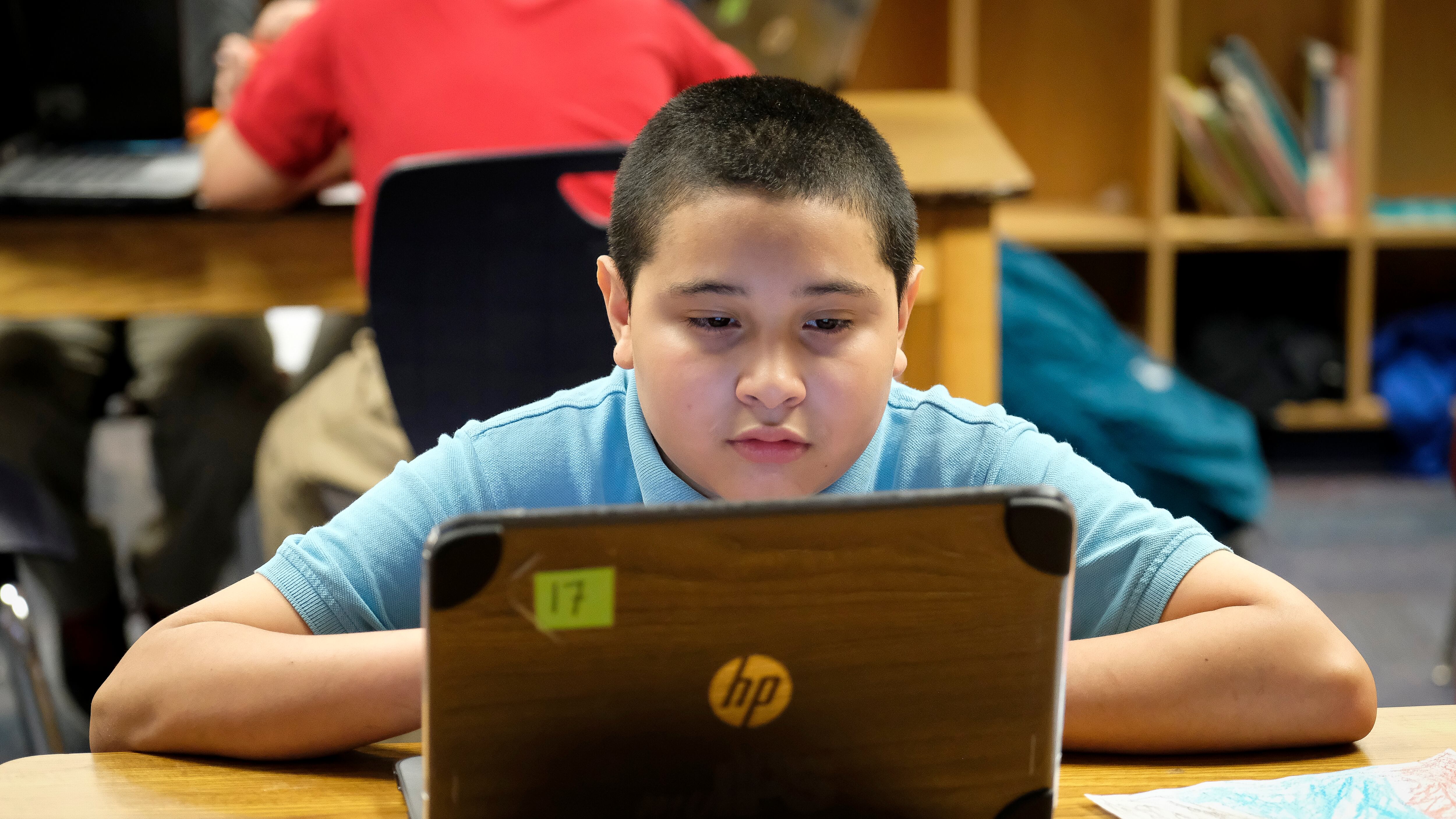 A student works on a laptop computer in class at Thomas Gregg Neighborhood School, an elementary school in Indianapolis, Indiana. —April, 2019— Photo by Alan Petersime/Chalkbeat