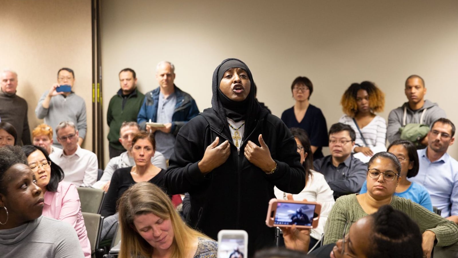 Parent Lorraine Reid argued for more resources for schools serving mostly children of color at a public meeting to discuss plans to integrate District 28 middle schools.