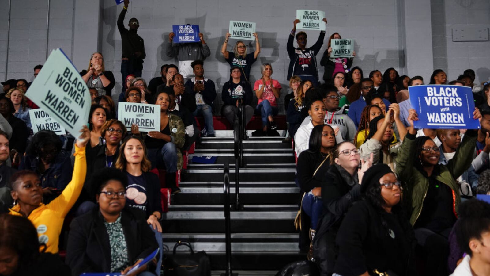 Attendees cheer and hold signs as Sen. Elizabeth Warren (D-MA), speaks at a campaign event at Clark Atlanta University on November 21, 2019 in Atlanta, Georgia.