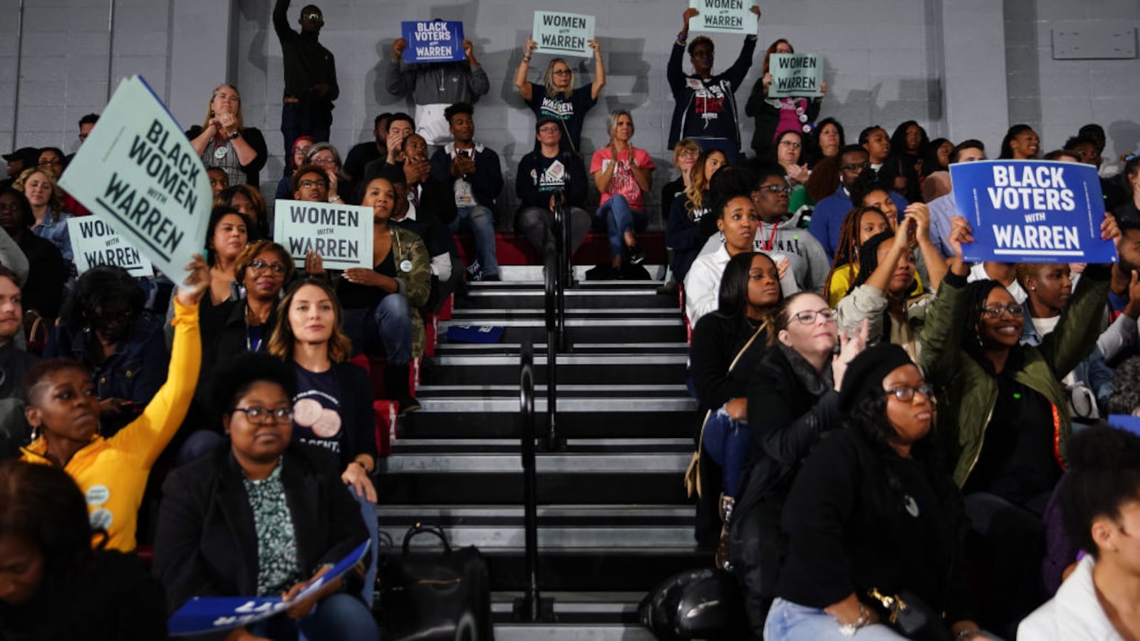 Attendees cheer and hold signs as Sen. Elizabeth Warren (D-MA), speaks at a campaign event at Clark Atlanta University on November 21, 2019 in Atlanta, Georgia.