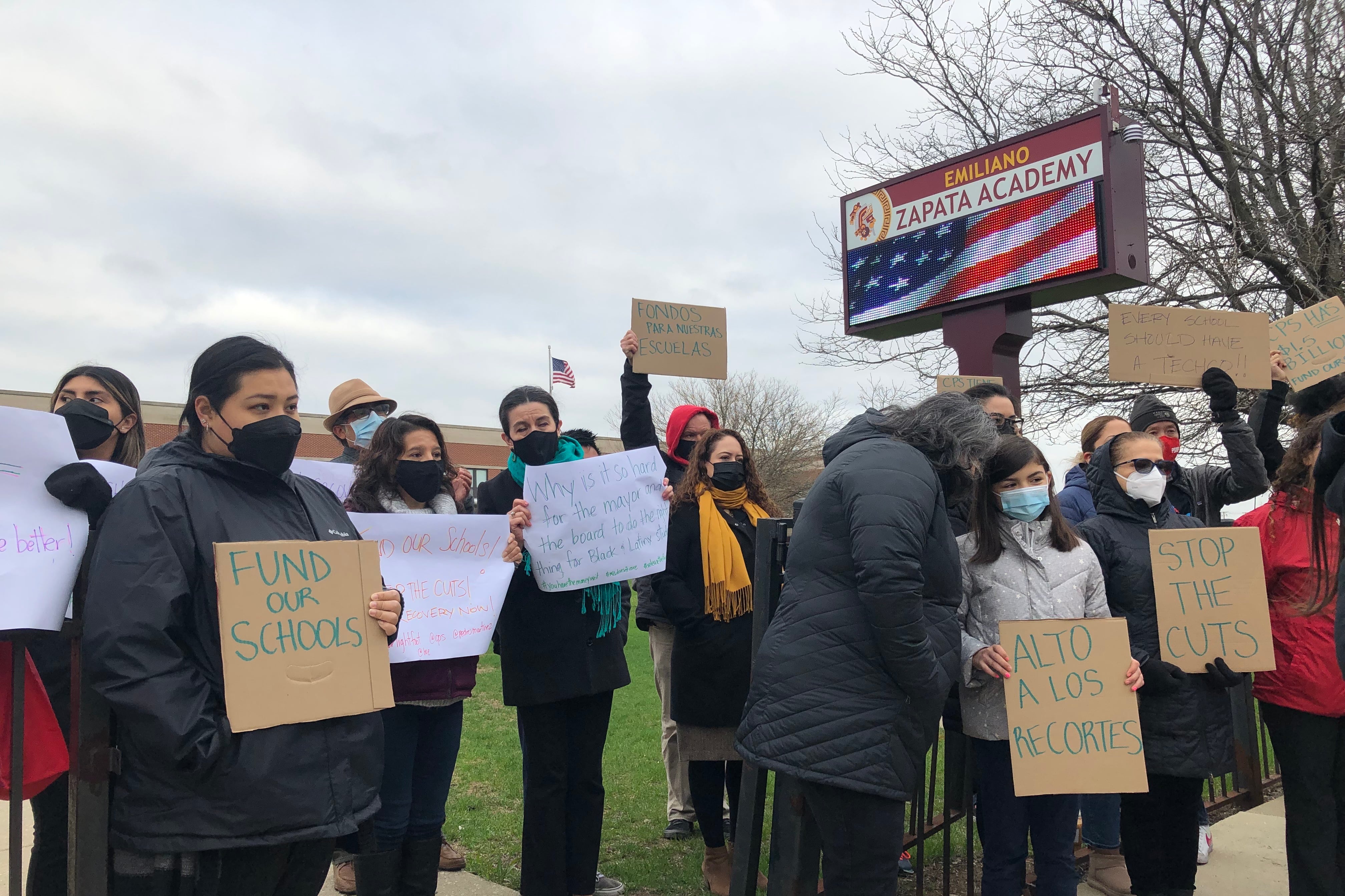 Nearly 50 Chicago Teachers Union members, parents, elected officials, and community groups decry budget cuts at Zapata Academy.