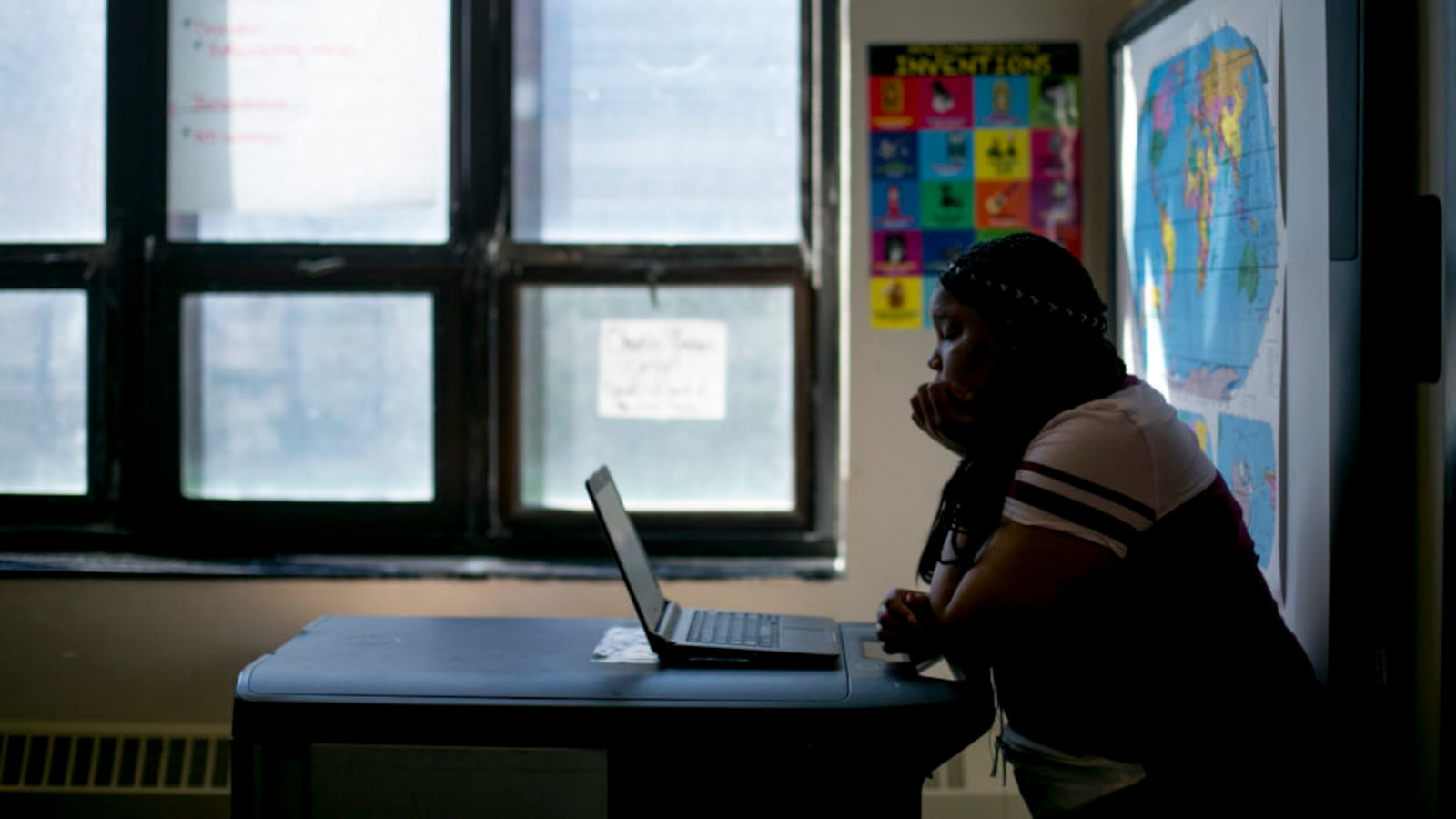 A high school student works on a laptop in a math class at Detroit Public Schools. The district uses Khan Academy to prepare students to take the PSAT and SAT tests.