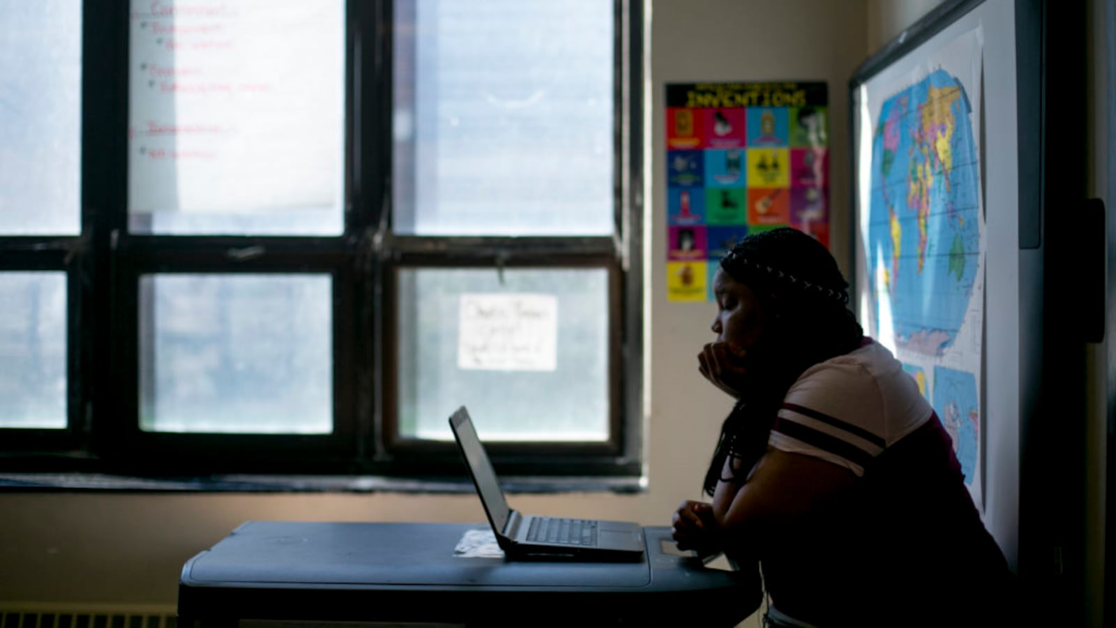 A high school student works on a laptop in a math class at Detroit Public Schools. The district uses Khan Academy to prepare students to take the PSAT and SAT tests.