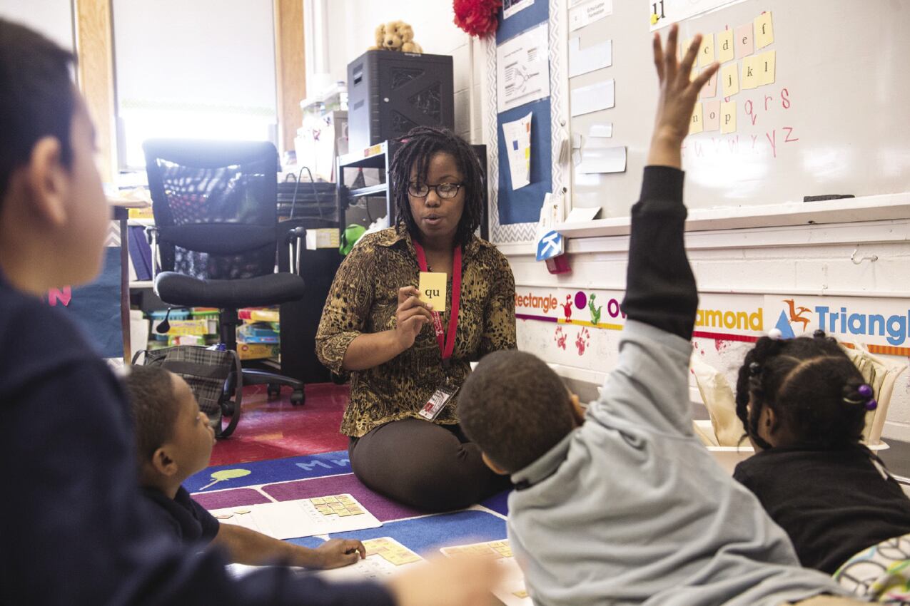 A teacher is shown with her students during class in Philadelphia.