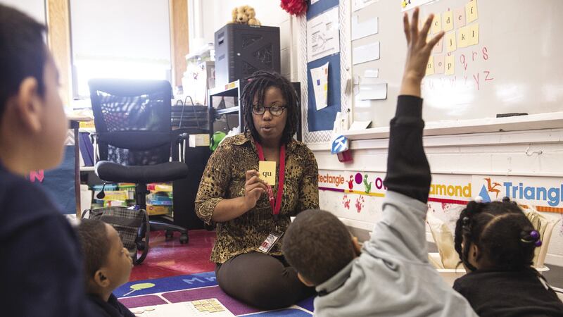 A teacher is shown with her students during class in Philadelphia.