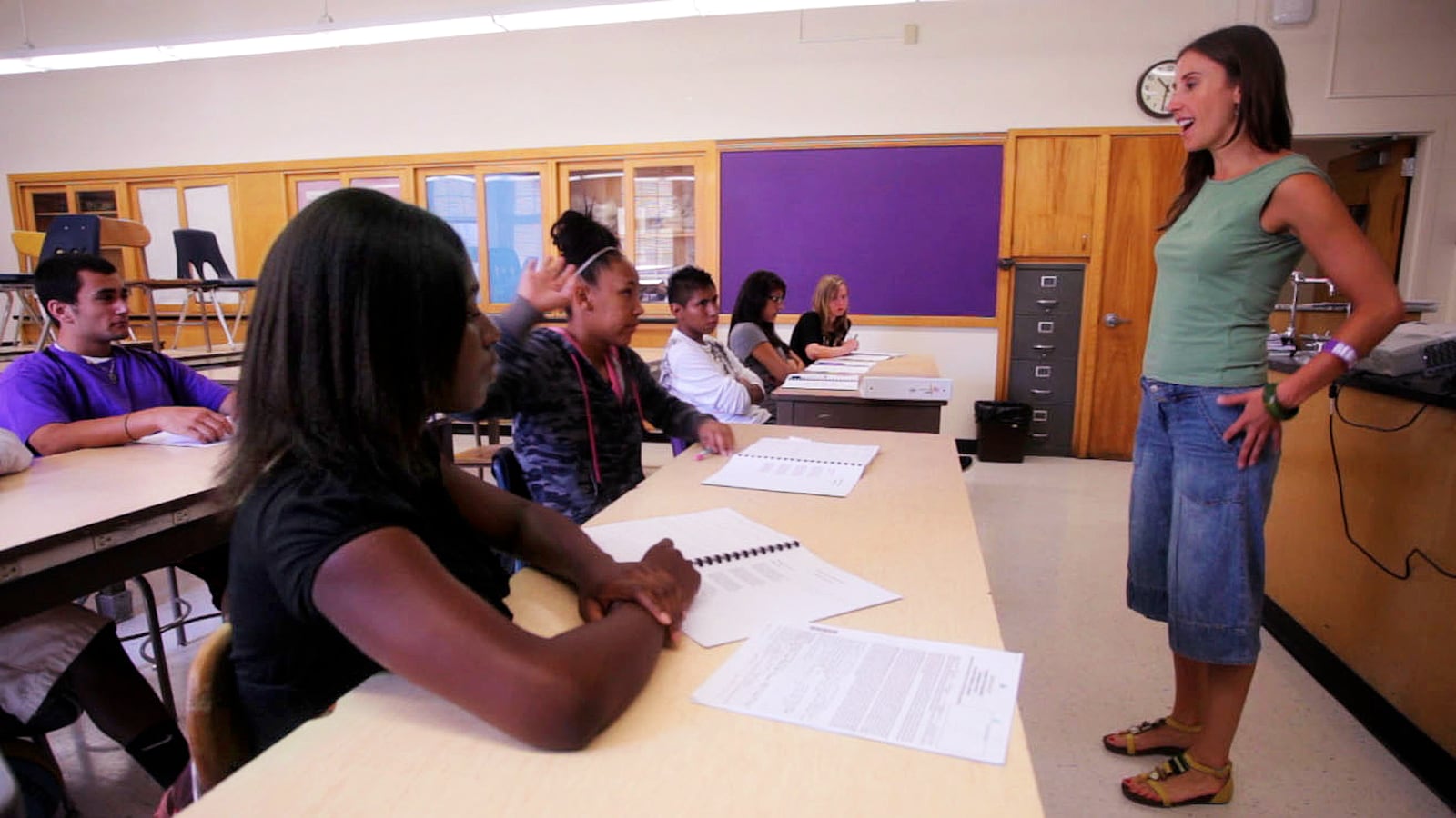 Denver Public Schools art teacher Shauna Twardzik, right,  talks to students at South High School. The ratio of black and Latino students to black and Latino teachers in DPS has improved over the last 40 years, but remains at about 50-to-1. The white student to white teacher ratio is 4-to-1.
