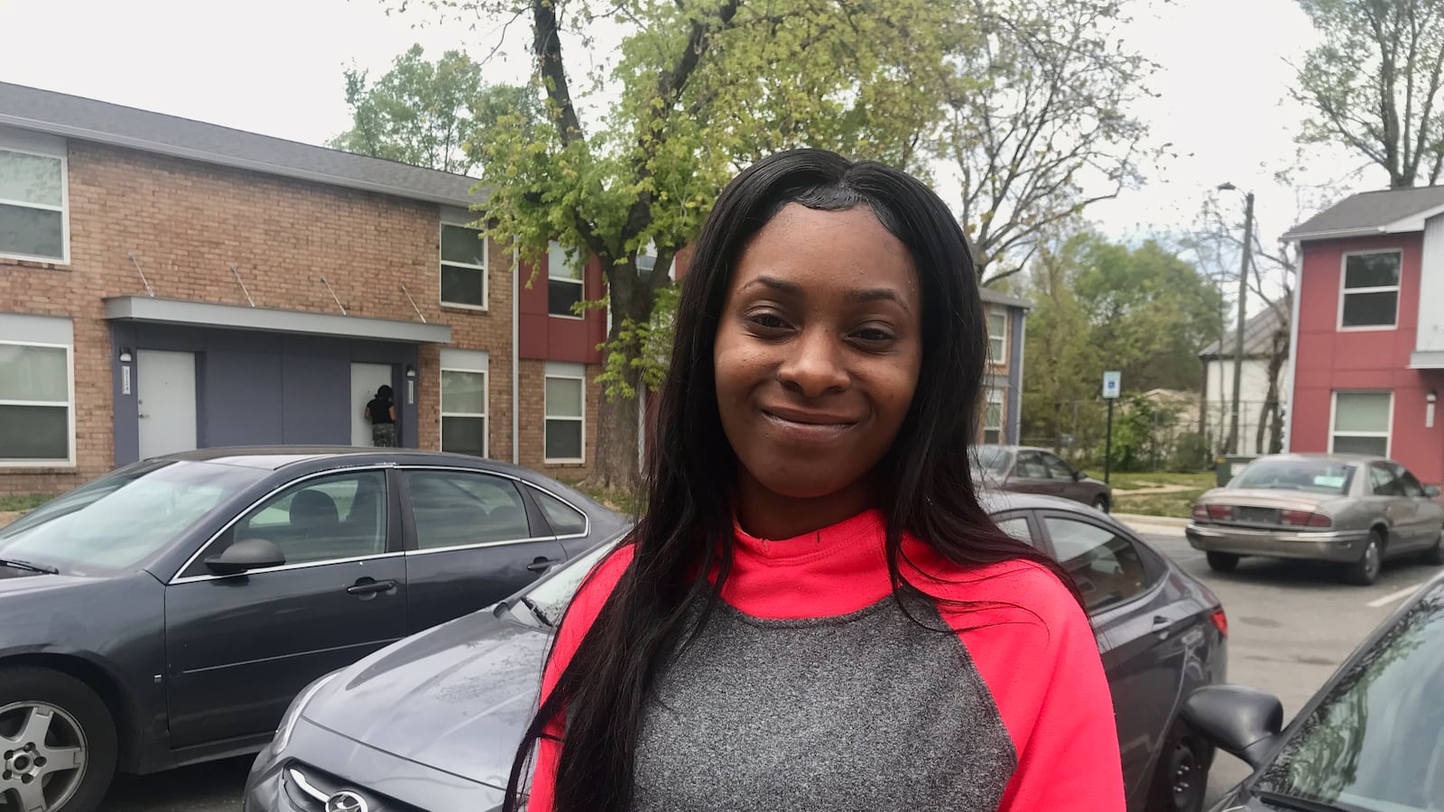 Azah Gillespy outside her apartment.