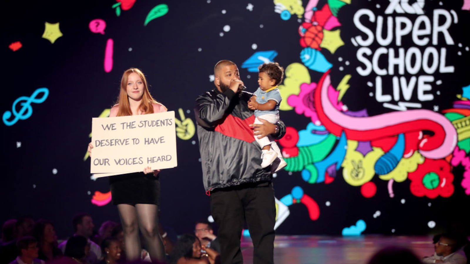 SANTA MONICA, CA - DJ Khaled (L) and son Asahd Tuck Khaled speak onstage during the XQ Super School Live, presented by EIF, at Barker Hangar on September 8, 2017 in California.
