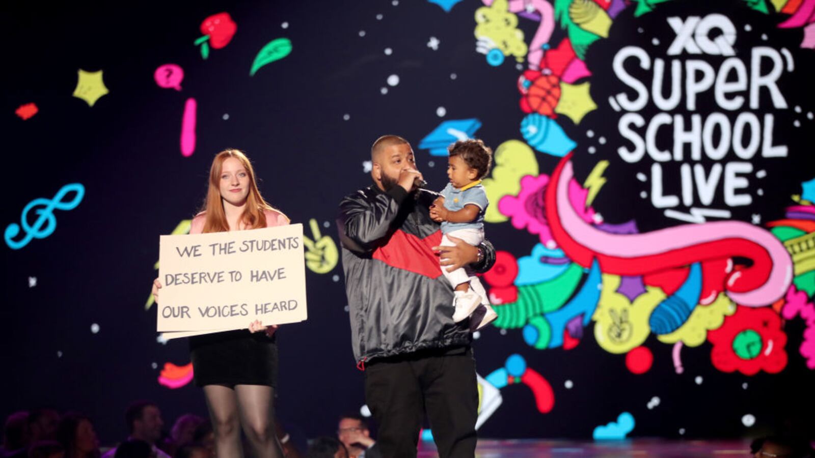 SANTA MONICA, CA - DJ Khaled (L) and son Asahd Tuck Khaled speak onstage during the XQ Super School Live, presented by EIF, at Barker Hangar on September 8, 2017 in California.