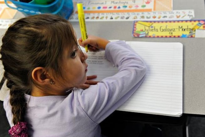 First grader Julieta Galaviz-Montoya works with her highlighter at Alice Terry Elementary School on Oct. 2, 2012.