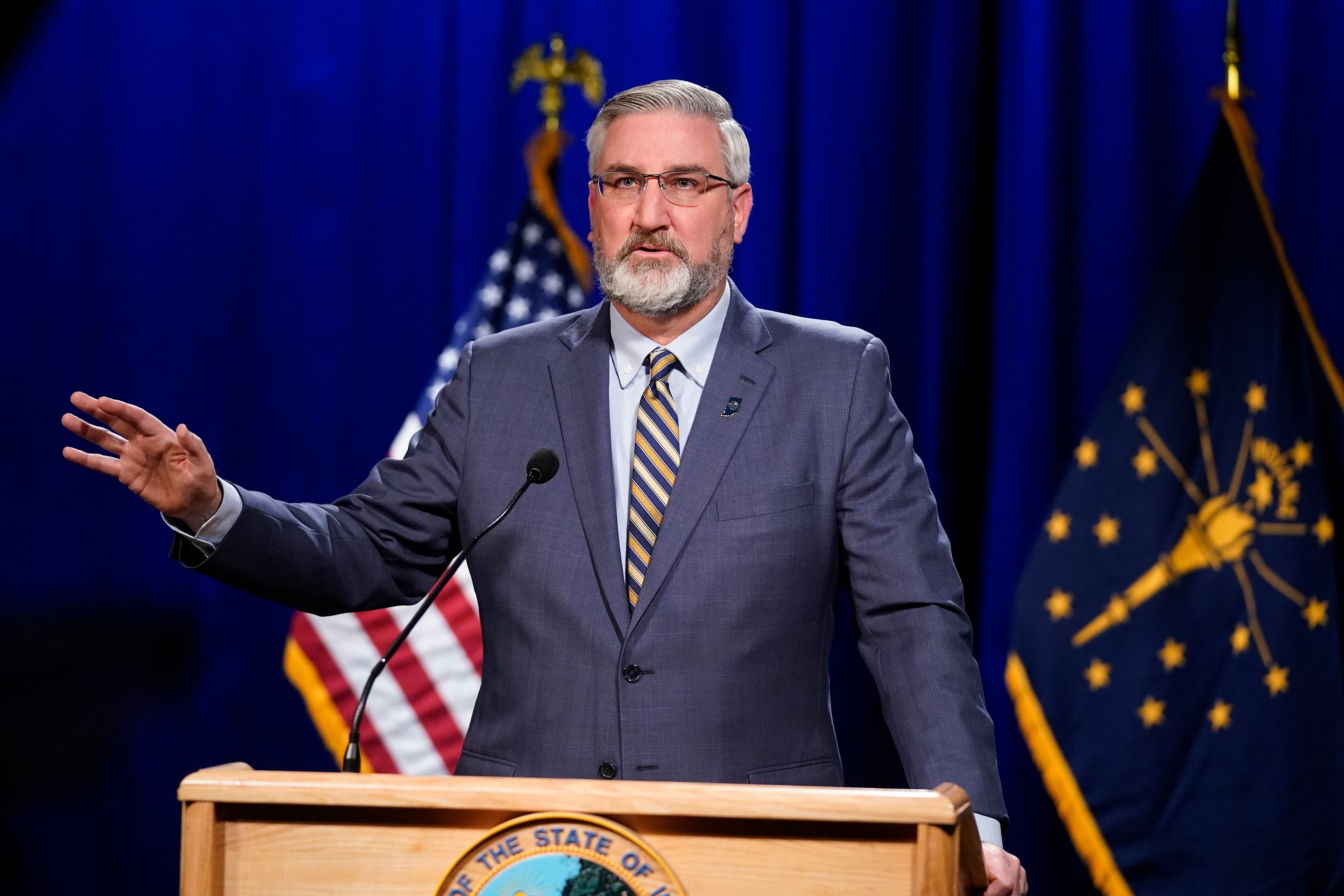 Eric Holcomb at a podium.