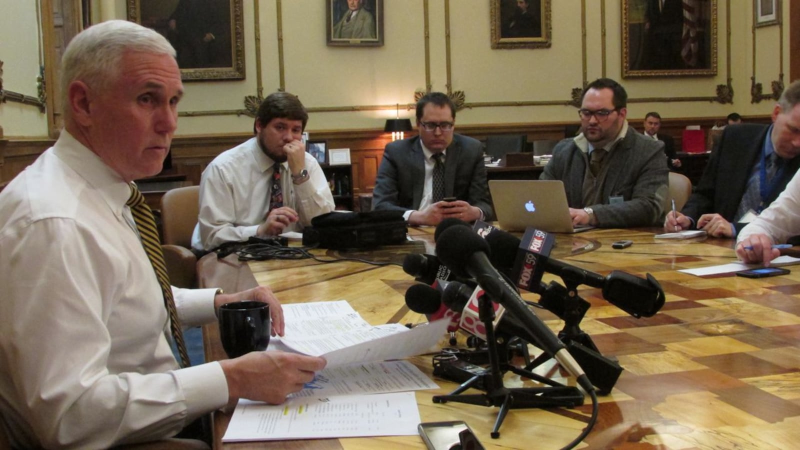 Gov. Mike Pence speaks with reporters about ISTEP in his office last week.