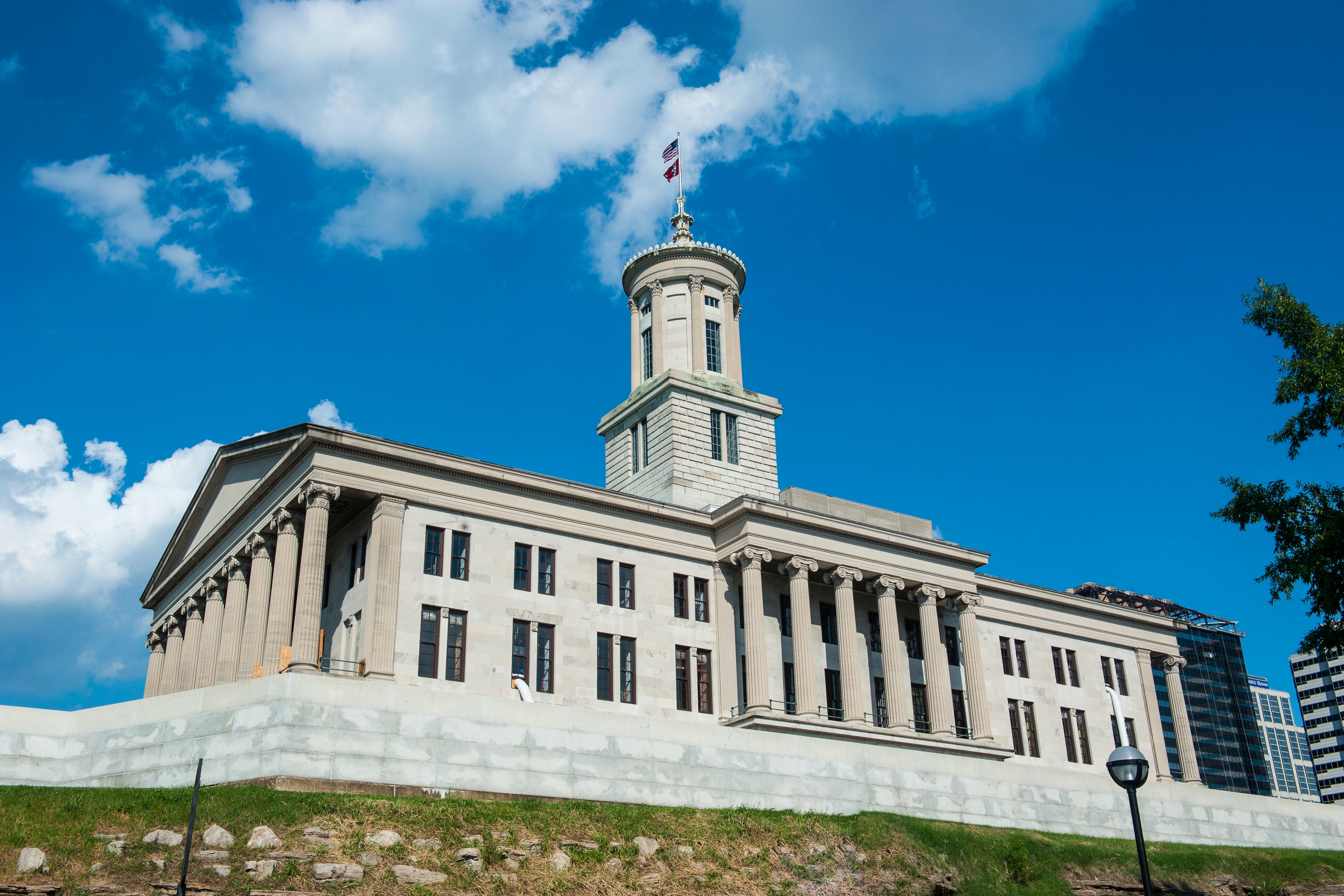 A white building with columns and a dome.