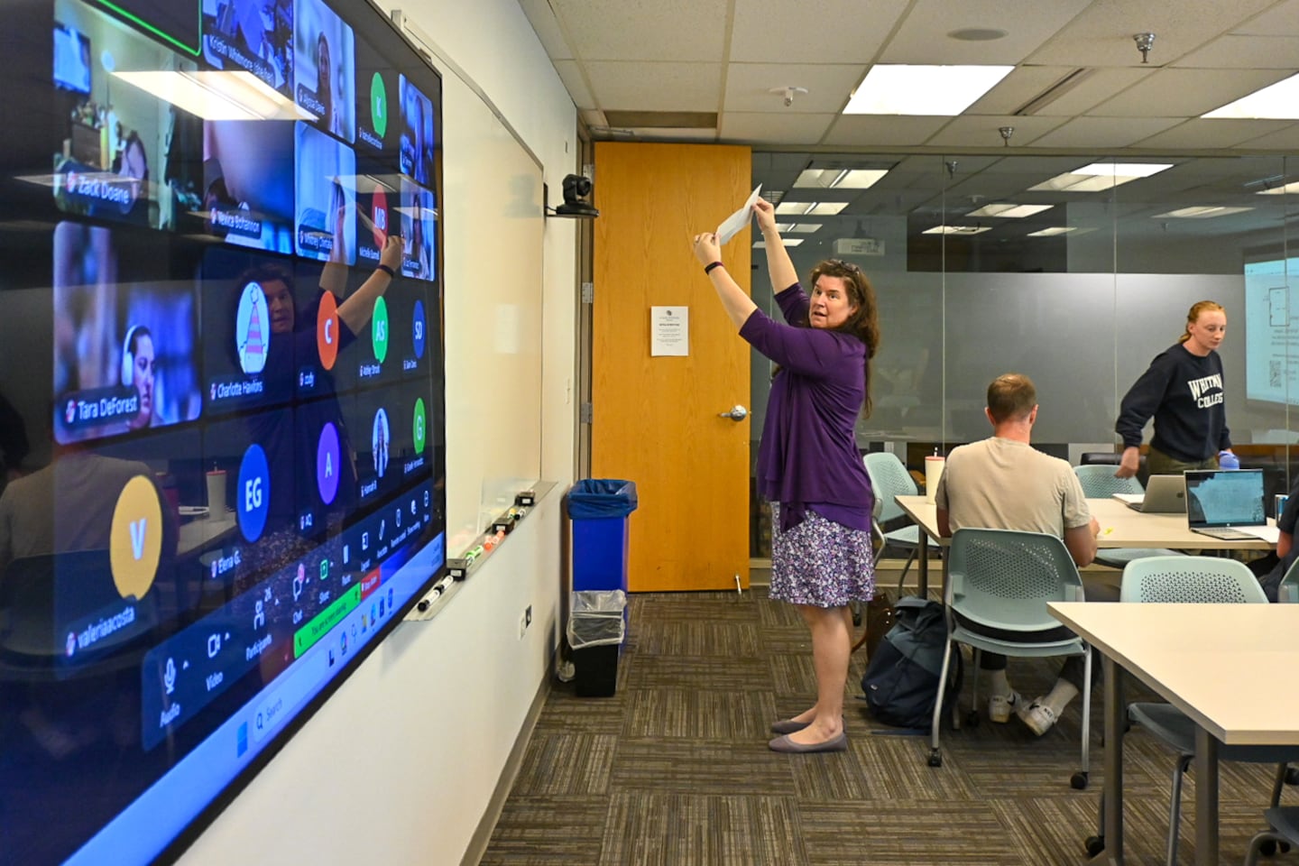 Senior Instructor Kristin Whitmore holds up a piece of a paper to a video camera to demonstrate an assignment in her CU Denver Mathematics for Elementary Teachers classroom on Monday, Oct. 12, 2026 in Denver. Whitmore teachers a hybrid in-person and remote class that meets once a week.