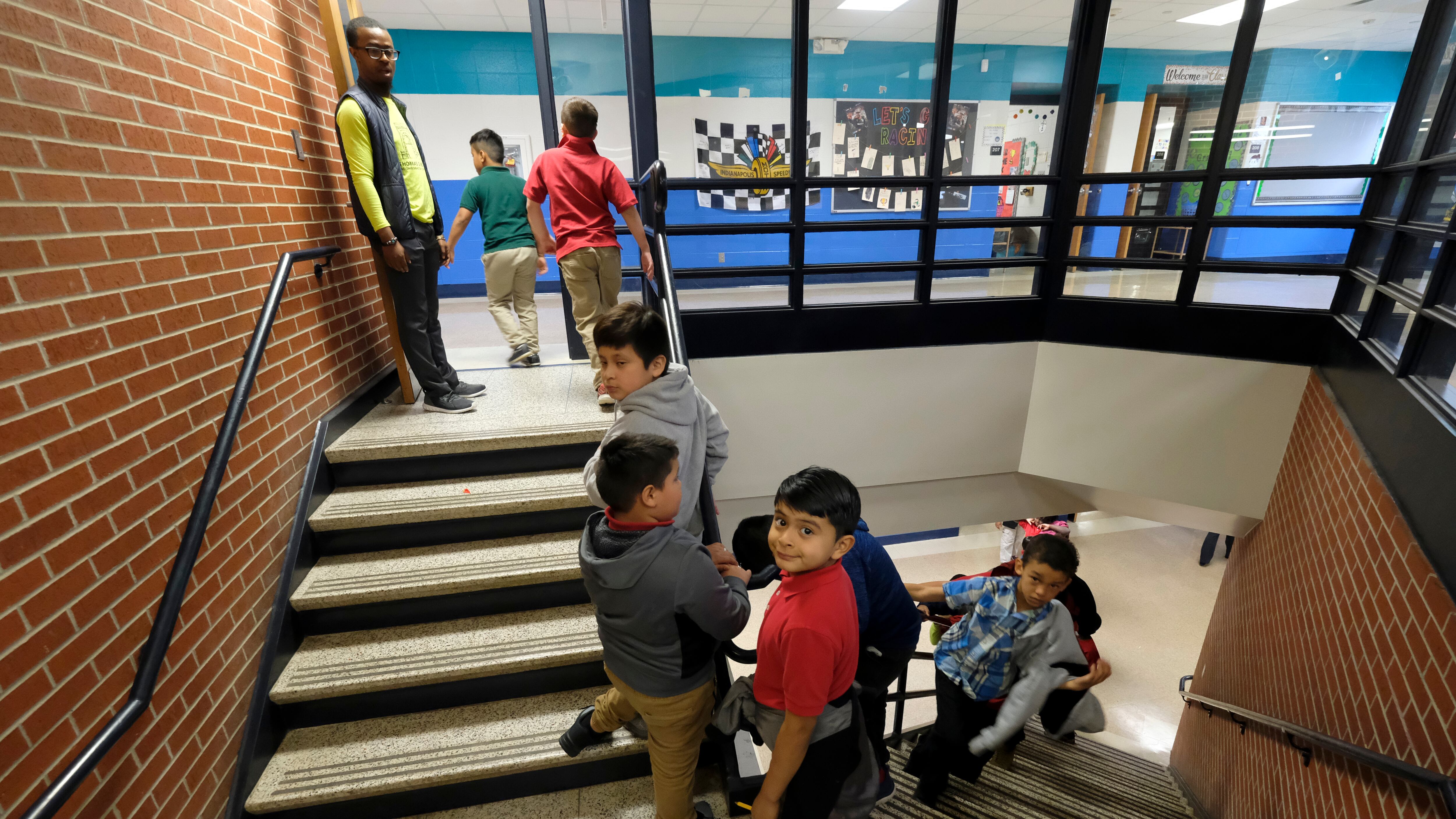 Children near indoor stairs of Thomas Gregg Neighborhood School, one of 26 innovation schools in Indianapolis Public Schools.