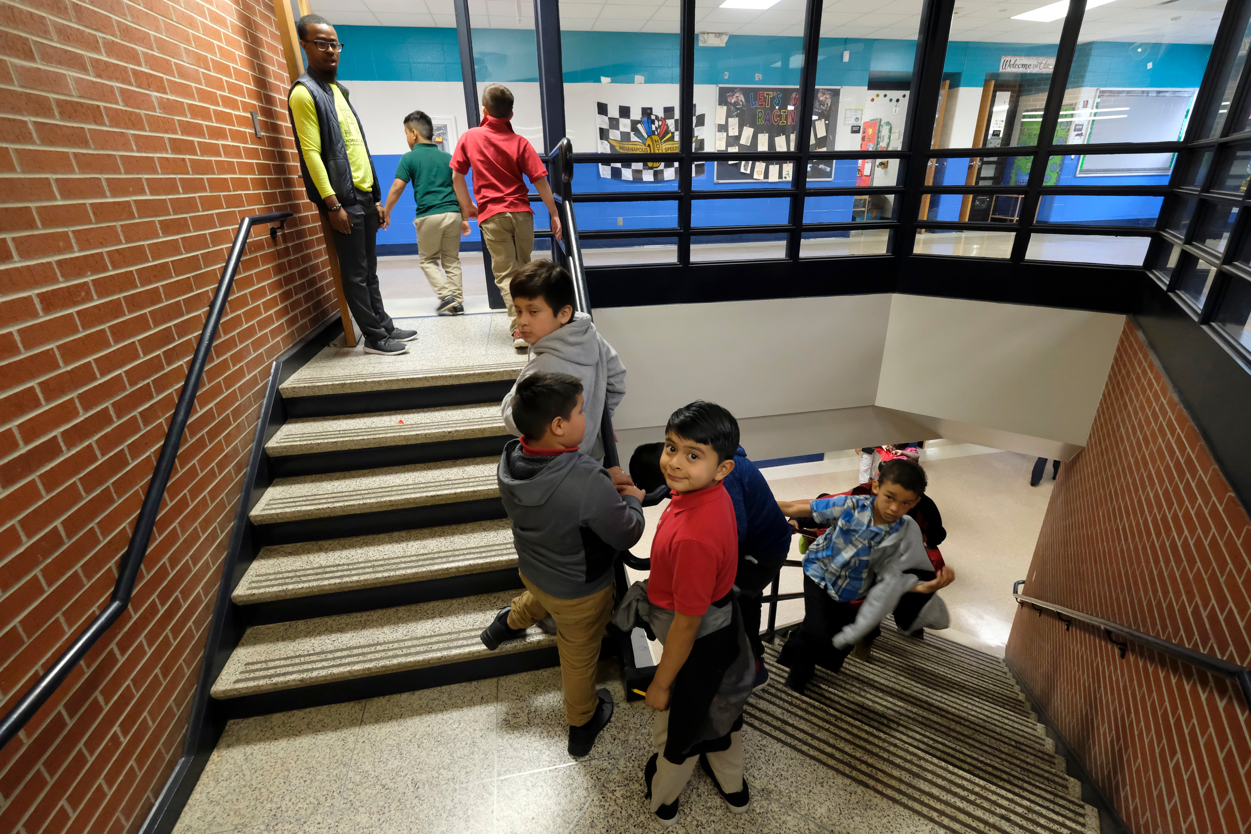 Children near indoor stairs of Thomas Gregg Neighborhood School, one of 26 innovation schools in Indianapolis Public Schools.