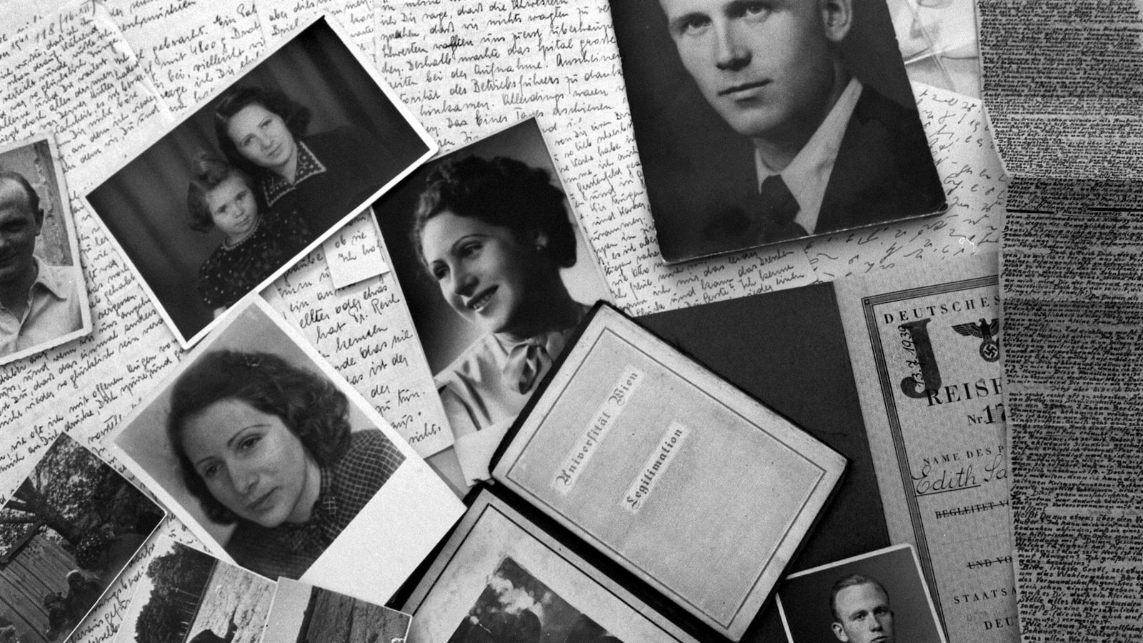 Photo depicts black and white family photographs scattered over hand-written letters and journals.