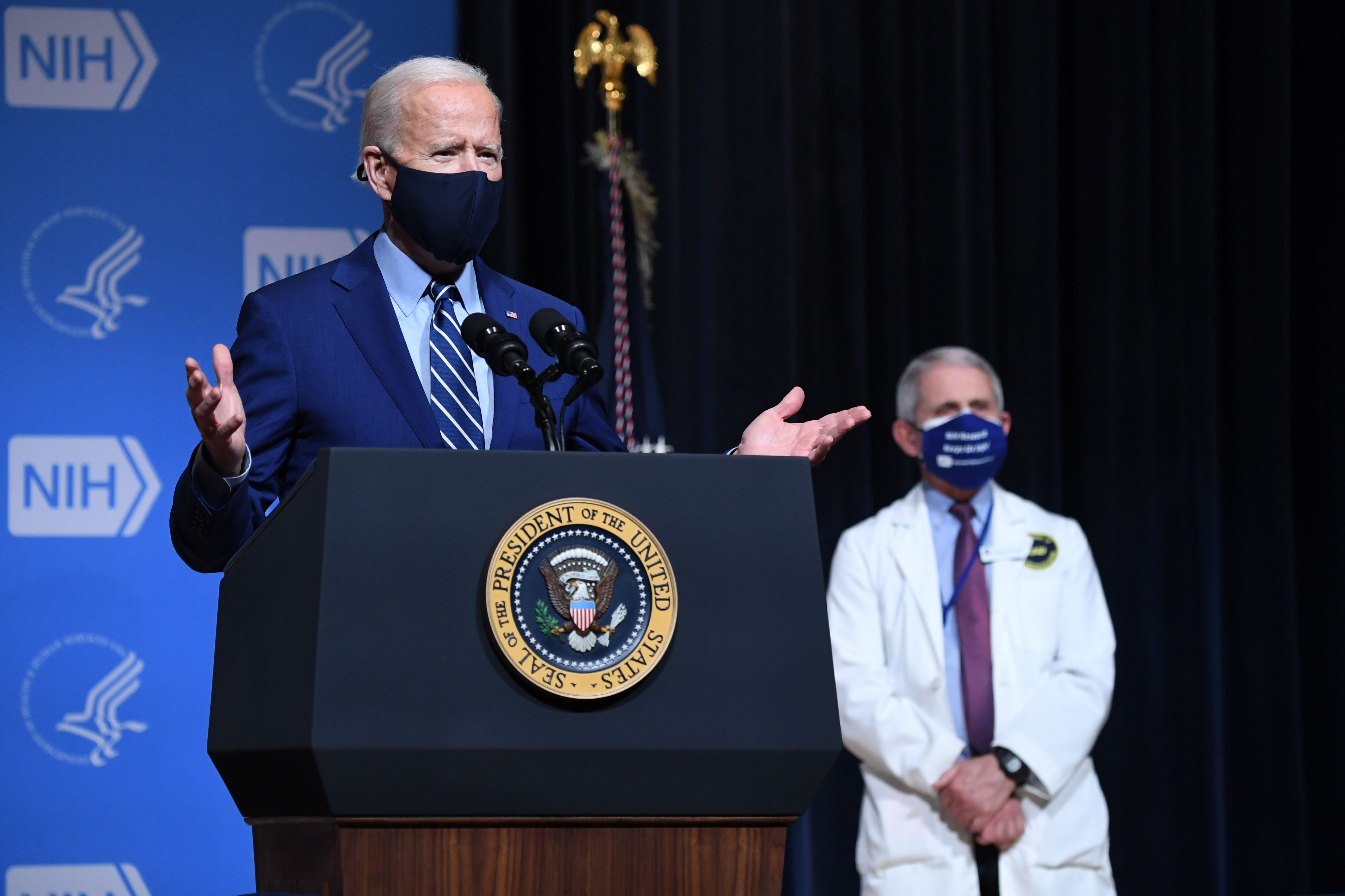 President Joe Biden, flanked by White House Chief Medical Adviser on Covid-19 Dr. Anthony Fauci during a visit to the National Institutes of Health in Bethesda, Maryland, on Feb. 11, 2021.