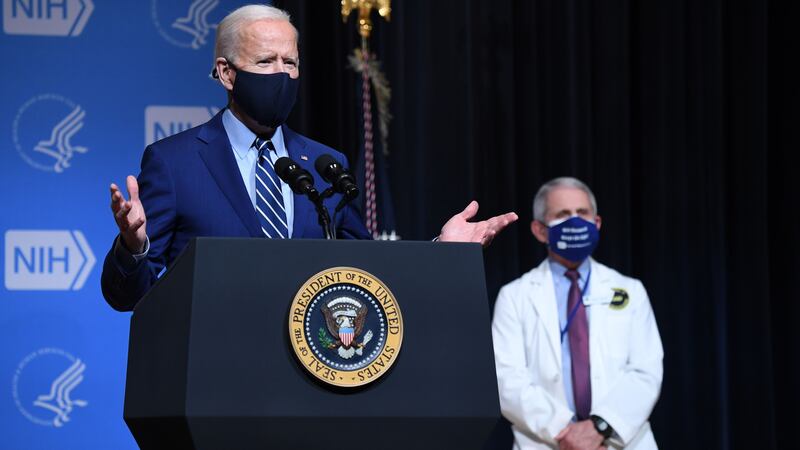President Joe Biden, flanked by White House Chief Medical Adviser on Covid-19 Dr. Anthony Fauci during a visit to the National Institutes of Health in Bethesda, Maryland, on Feb. 11, 2021.