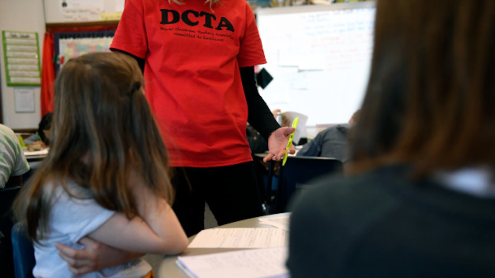 A teacher wears a Denver Classroom Teachers Association T-shirt in class during the strike.