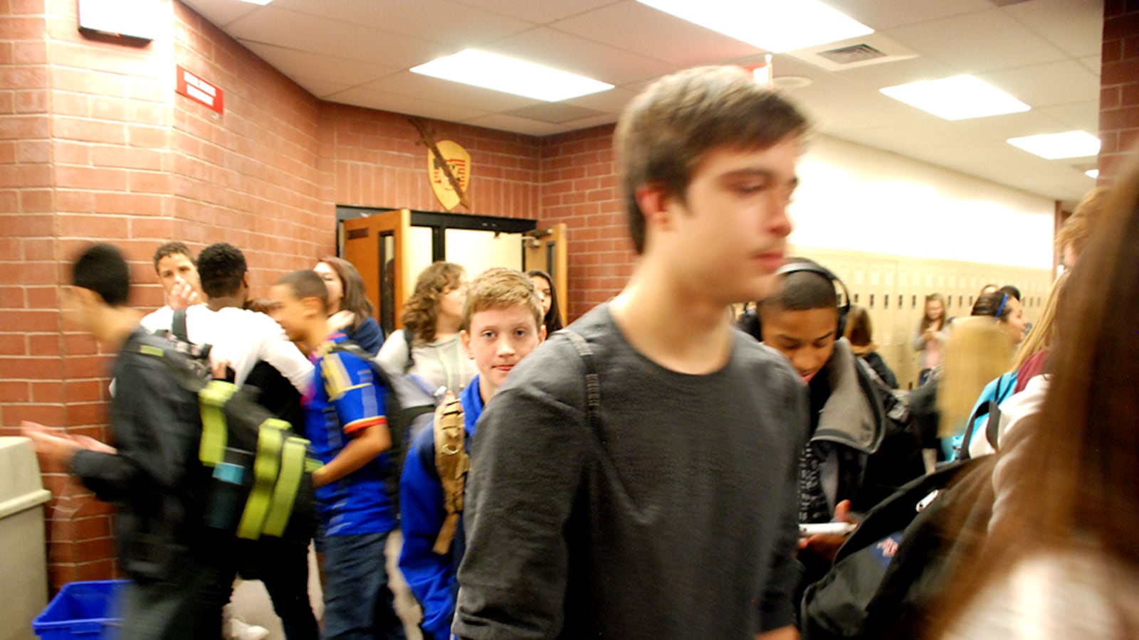 Students at Rangeview High School in Aurora walk through the hall during passing period.