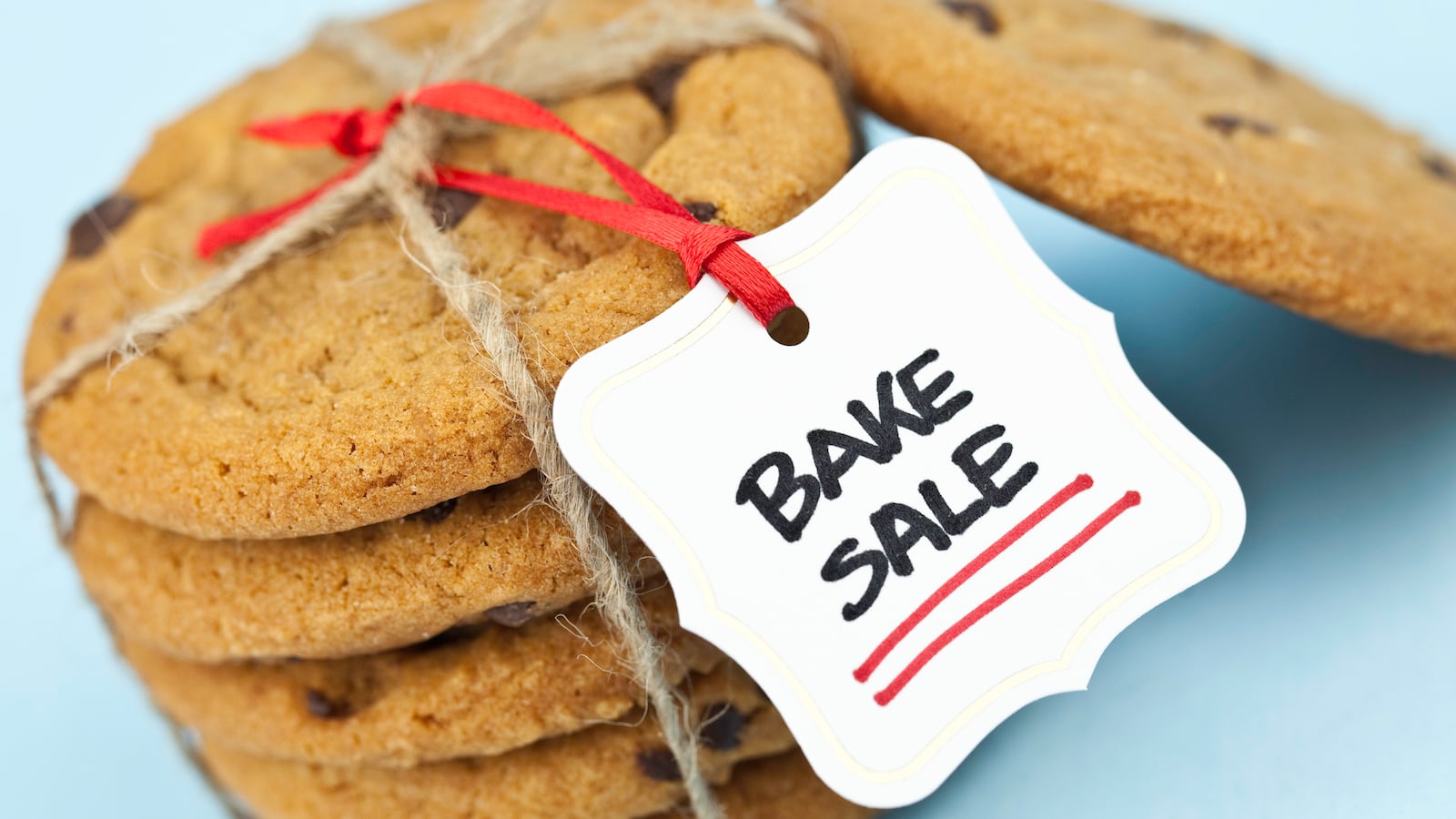 Freshly baked cookies wrapped and tagged for a Bake Sale.