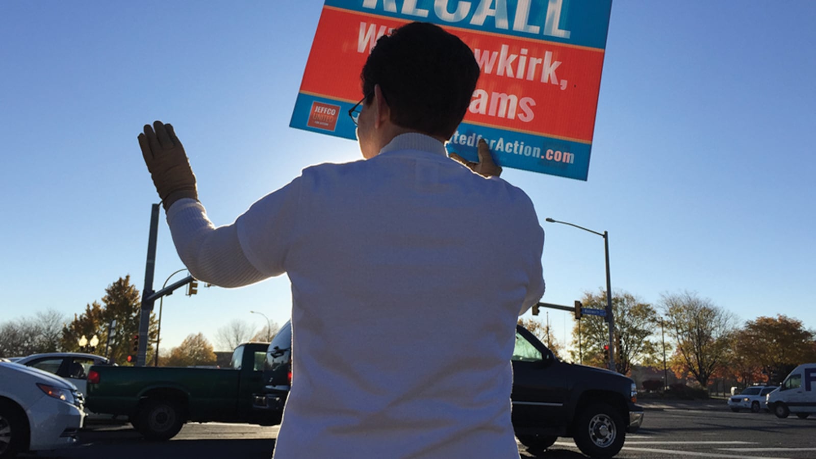 Recall supporter Cecelia Lange waved signs at 52nd and Wadsworth Tuesday morning.