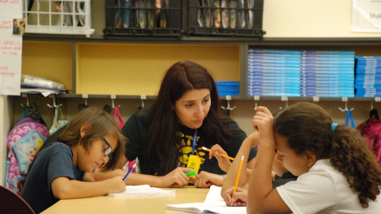 Paris Elementary School teacher Elizabeth Rodriguez checks in with students on Aug. 28 2015. (Photo by Nic Garcia)