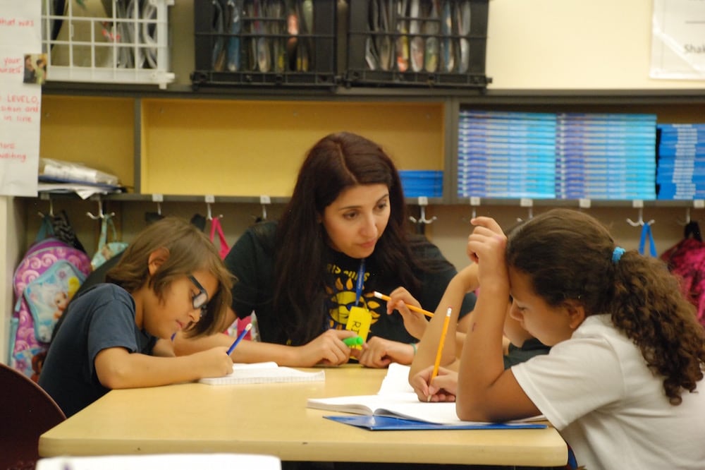 Paris Elementary School teacher Elizabeth Rodriguez checks in with students on Aug. 28 2015. (Photo by Nic Garcia)
