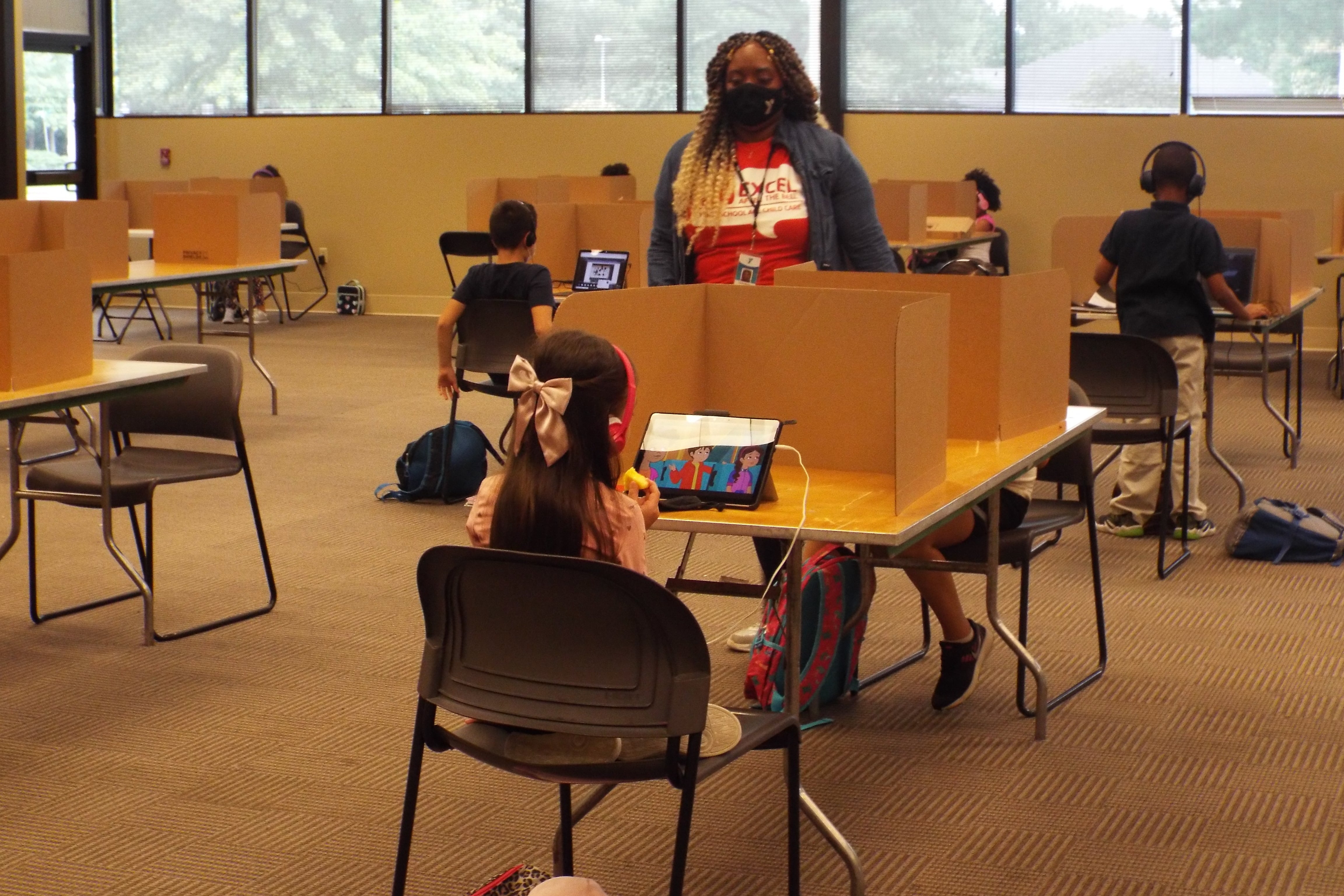 Shelby County Schools students log in remotely from the YMCA’s virtual learning center on the first day of school.