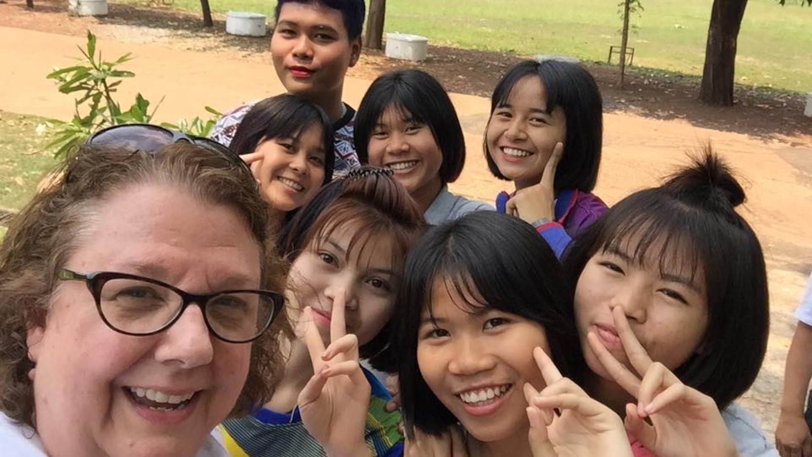 Kelly Bentley posted a photo of herself and Thai students on Facebook. The students hosted American teens enrolled in a study abroad program IPS could join.