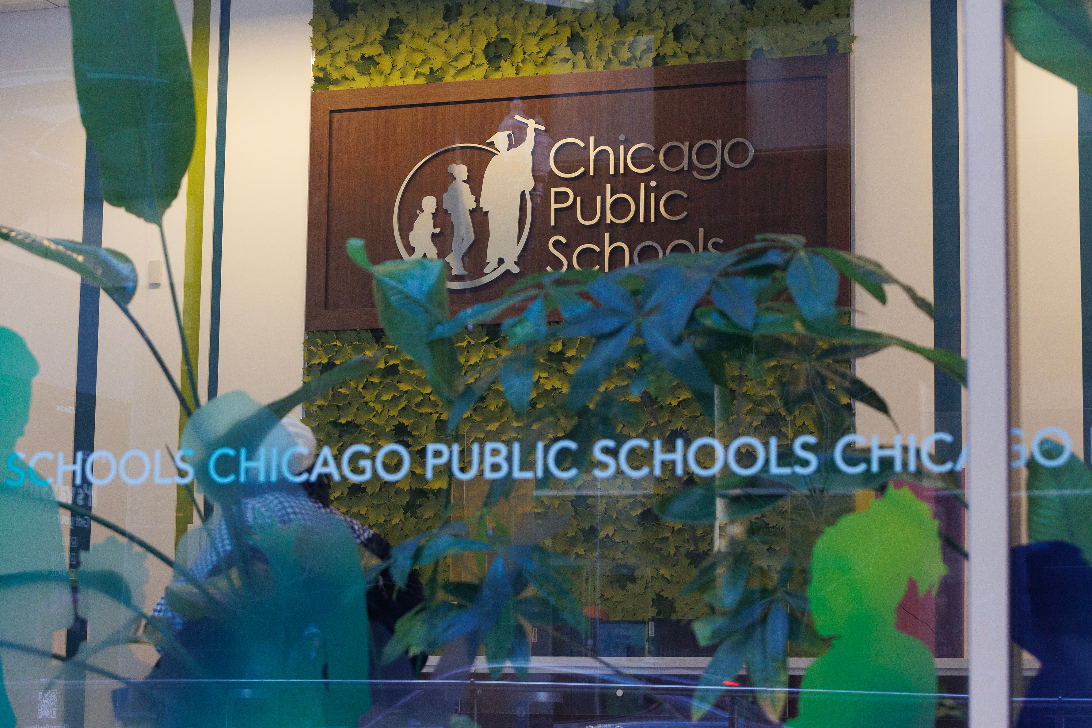 The front of a building with writing on the window.