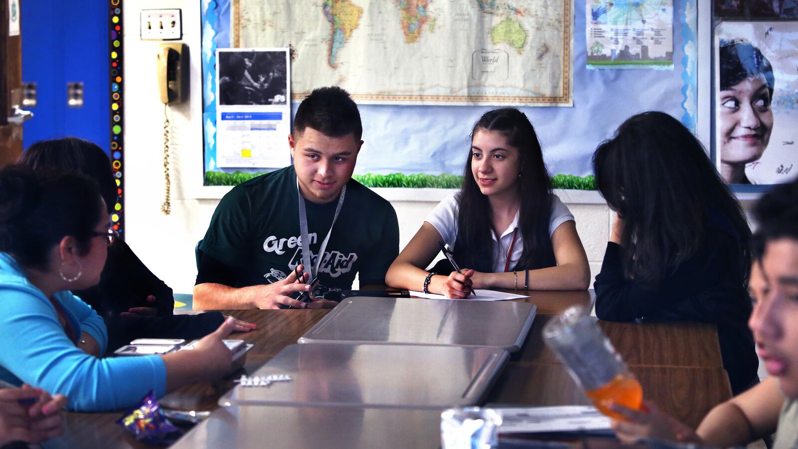 Cruz Tapia joins in a discussion among members of the United Northwest club about a documentary video on diversity during an after-school meeting at Northwest High School in Indianapolis. To his right is Maria Ulloa-Loza. Claudia Montes (left) is the college and career readiness adviser for English learners.
