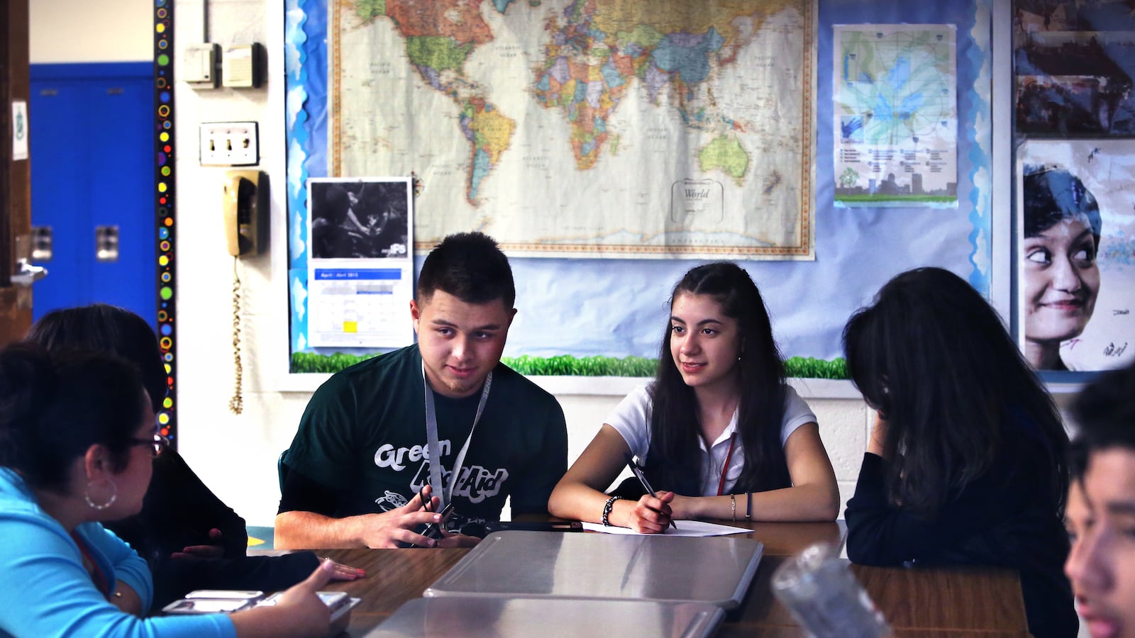 Cruz Tapia joins in a discussion among members of the United Northwest club about a documentary video on diversity during an after-school meeting at Northwest High School in Indianapolis. To his right is Maria Ulloa-Loza. Claudia Montes (left) is the college and career readiness adviser for English learners.