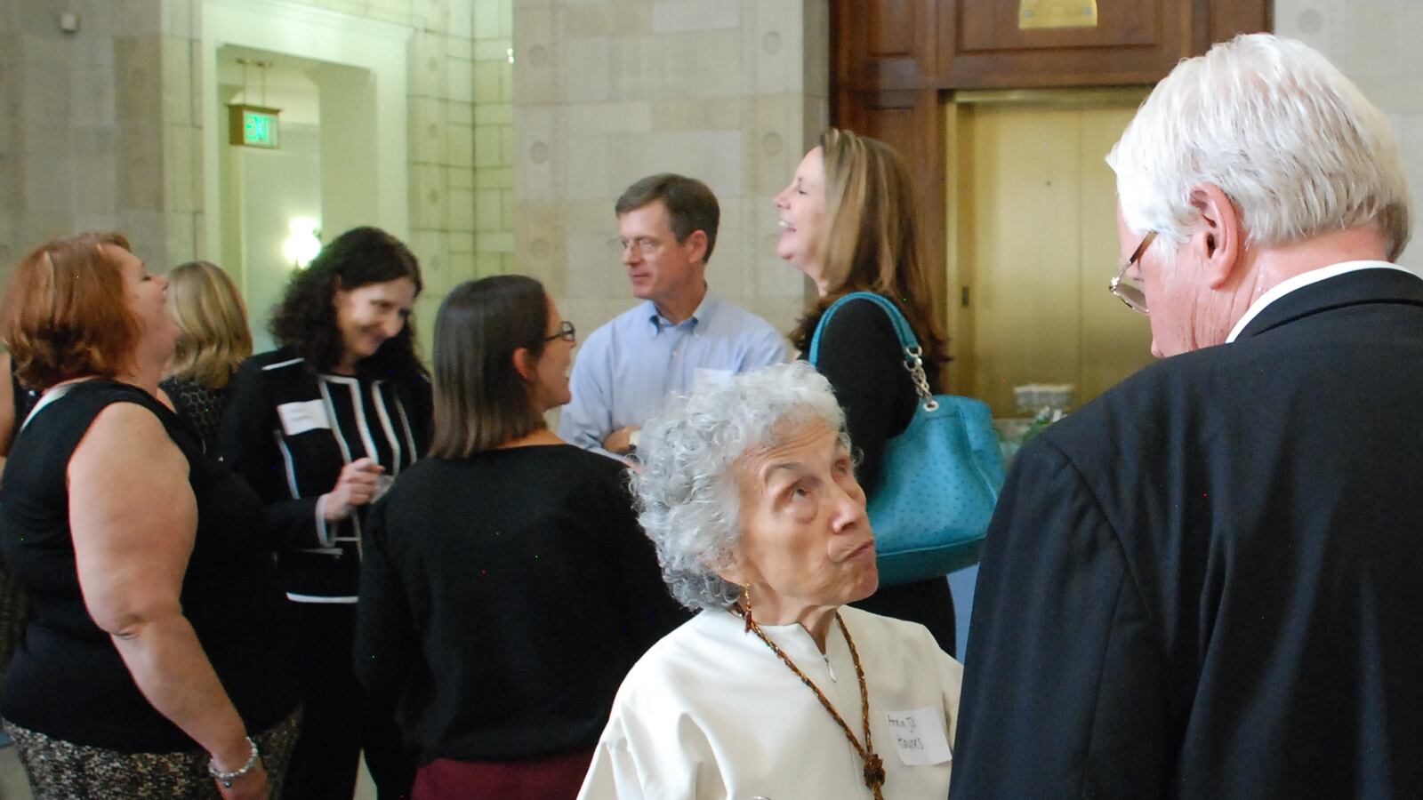 Anna Jo Haynes, co-chair of the Early Childhood Leadership Commission, chats with a guest at an event celebrating the release of the new Early Childhood Colorado Framework on Wednesday.