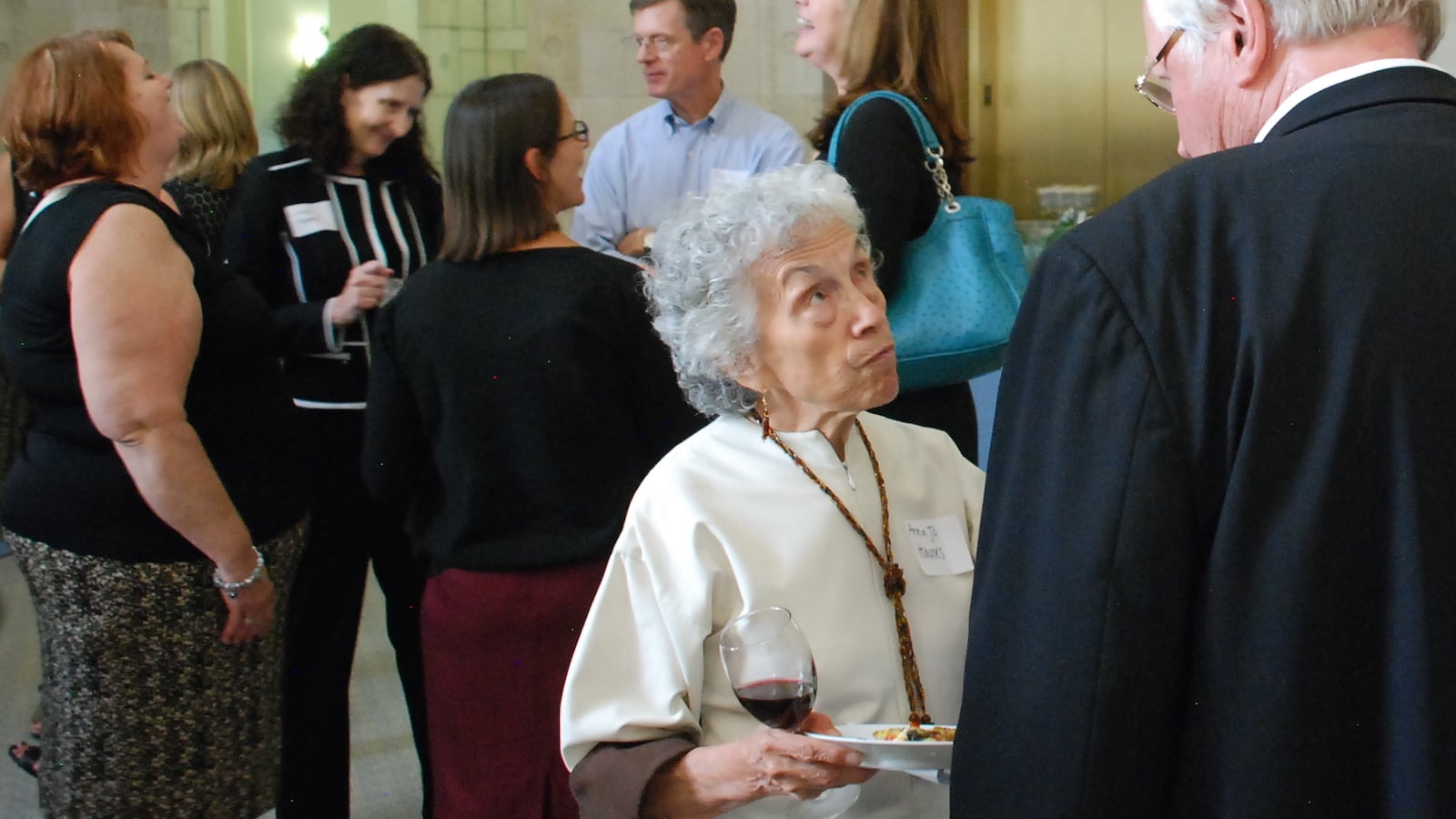 Anna Jo Haynes, co-chair of the Early Childhood Leadership Commission, chats with a guest at an event celebrating the release of the new Early Childhood Colorado Framework on Wednesday.