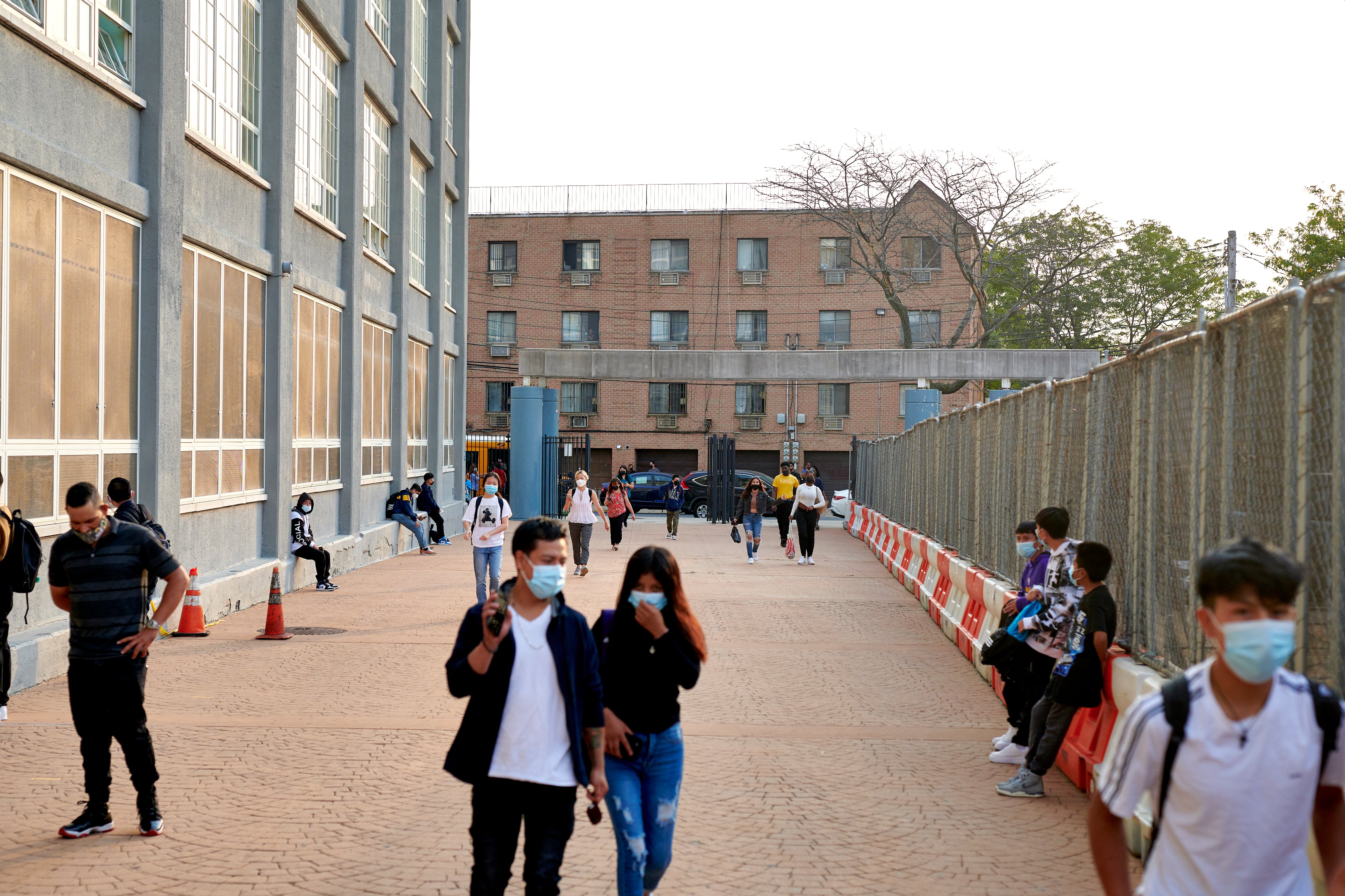 Students walk ouside a school building
