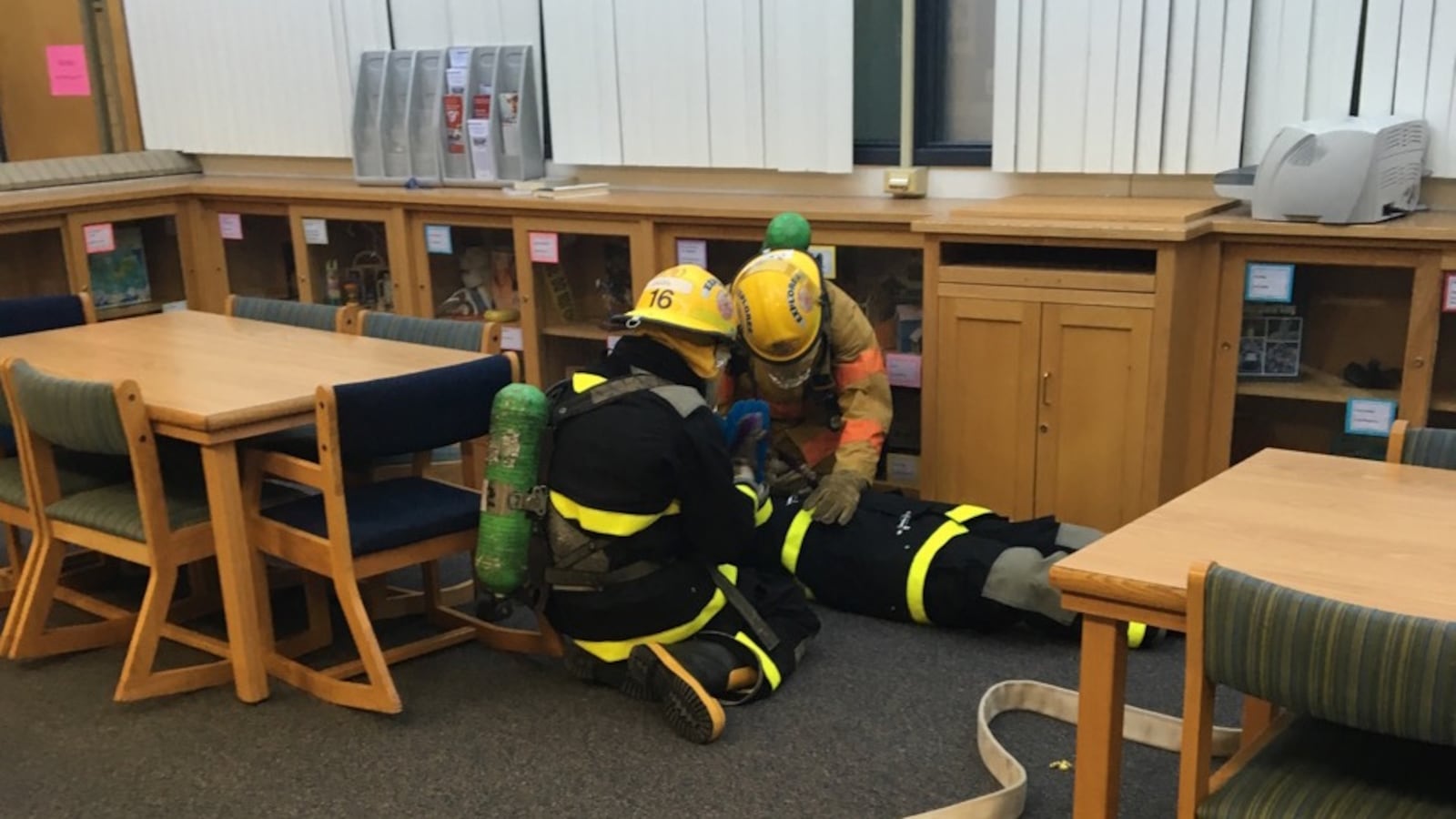 Students at CEC Early College in Denver practice a rescue in full firefighter gear.